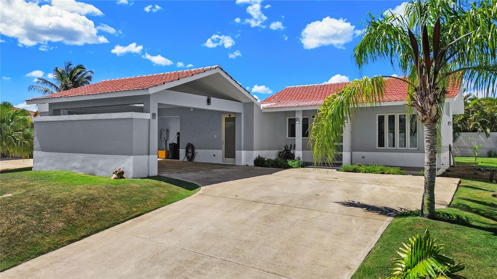 Situated within the established community of Sabanera de Dorado, 272 Camino del Guayacán features thoughtfully selected upgrades to key areas. At the heart of the home is a renovated kitchen designed for everyday living and entertaining, featuring updated cabinetry, a gas range, and a wine refrigerator. Within the primary suite, the bathroom has been completely remodeled, and a new custom closet system has been installed.The kitchen opens seamlessly to the formal living and dining areas, as well as the adjacent den, creating a connected layout ideal for everyday living and entertaining. The bedrooms, and covered terrace retain the home’s original character and provide an opportunity for future owners to personalize the spaces over time. With three bedrooms, three full bathrooms, and one powder room, the residence offers a flexible layout for family life, hosting guests, or working from home.Set on a 750-square-meter lot, the property offers a private yard and the covered terrace further enhances the home’s indoor-outdoor lifestyle.Essential infrastructure is already in place, including a 13 kW generator, 100-gallon water cistern, and water-softening system—providing added comfort and convenience for everyday living in Puerto Rico.Residents of Sabanera Dorado enjoy access to exceptional amenities, including scenic golf cart trails, a fitness center, sports hub which includes both pickle ball and beach courts along with a dog park, lap pool, convenience store, and a full-service restaurant. Families especially value the presence of TASIS Dorado, the renowned school founded in partnership with The American School in Switzerland.