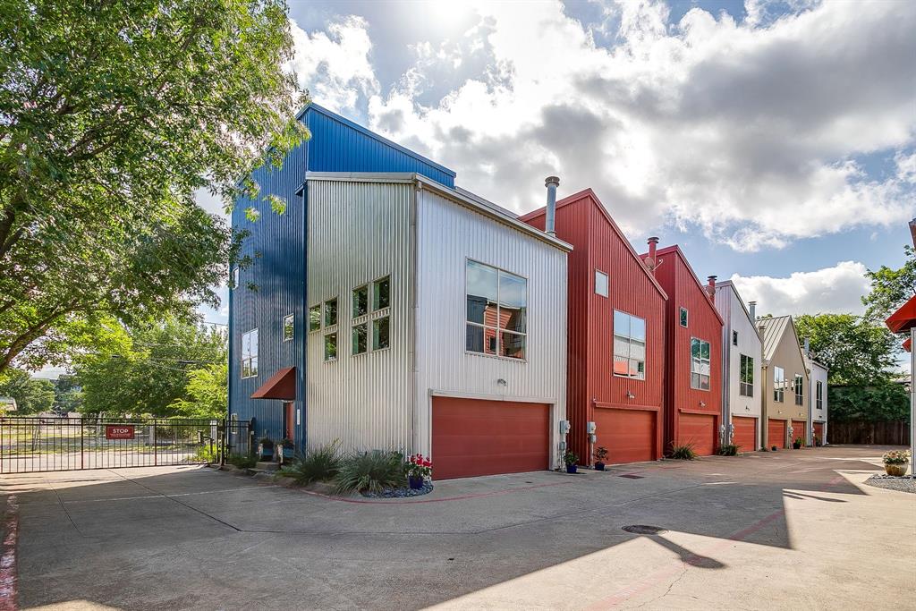 Incredibly rare opportunity to purchase 2 side by side townhomes in vibrant East Dallas. If you've desired an urban lifestyle, but didn't think you could find the garage space you need - this is for you! This small gated townhome community is in the heart of Dallas - minutes to downtown, the Arts District, Baylor Medical Center, Lower Greenville & walking distance to iconic Deep Ellum. The colorful industrial exterior leads you to loft style interiors with soaring ceilings, great natural light & designer touches throughout. The current owners have created a doorway to connect unit F & unit G on the ground floor - so they function perfectly as separate, but connected living units. This has been an ideal arrangement for multi-generational living but would also function beautifully to live on one side & work on the other. Plans have also been penned to modify the floor plan to create one XL living unit which would feature 5 bedrooms, incl 2 primary suites, 4 full & 1 half baths & 4 garage spaces - with over 3700 square feet of living space. It would also provide a fenced yard space large enough for a hot tub or small pool. The possibilities are truly endless. As they stand today - these townhomes are impressive and uniquely individual. Both feature 14' high vaulted ceilings & incredible light filled spaces. Unit G is an end unit with additional windows & warm wood flooring that gives it a comfortable, lived-in feel. Unit F feels sleek and modern but still grounded & cozy. Each unit has a fireplace in the living room & views of downtown. The neighborhood offers easy & convenient living with a grocery store minutes away & beautiful Exall Park & Recreation Center around the corner offering 10 acres of community green space. An easy walk to Jimmy's Food Store, a classic Italian market; or Common Good - a favorite neighborhood coffee & record shop. Tons of great vintage shopping within walking distance as well. You will LOVE living here