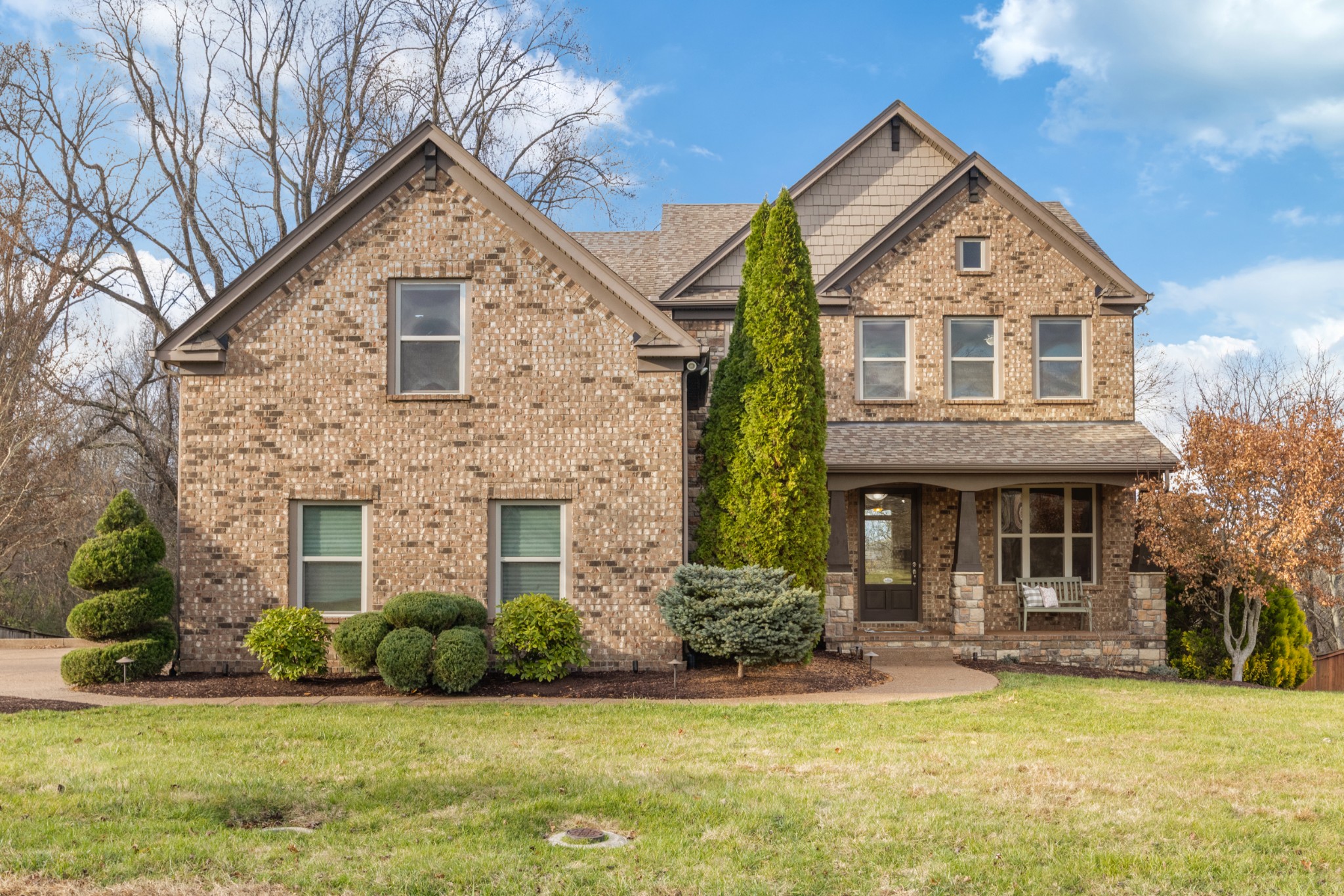 Welcome to this stunning all-brick residence in the highly sought-after Arrington Retreat community. Designed for flexibility and connection, this home offers comfort and space for a variety of living arrangements. Whether you’re seeking a private guest suite, multigenerational living, or simply room to spread out, this home checks every box. The walk-out basement provides step-free access and includes a full kitchen, making it ideal for guests, in-laws, adult children, or visiting friends.Inside, you’ll find 5 spacious bedrooms, 6 full bathrooms, and 2 half bathrooms, along with thoughtful storage throughout. Step into your own private movie experience in the dedicated home theater. This room features a large projection screen with a high-quality ceiling-mounted projector, delivering an immersive, cinematic feel. Plus, tiered theater seating ensures everyone gets the perfect view, while soft lighting and acoustic enhancements create a comfortable and intimate atmosphere. It’s the ideal spot for family movie nights, big game watch parties, or cozy weekends catching up on your favorite shows.. Backed by trees and natural views, the home offers privacy and a serene setting. There is an additional room in the basement featuring a full bathroom and a spacious walk-in closet. While it cannot be counted as a bedroom due to the absence of a window, it offers exceptional flexibility. Life in Arrington Retreat is all about community. Stroll the scenic walking trails, relax at the pool, explore the creek, or enjoy the wide-open green spaces. Directly across the street, the community overlook offers stunning, sweeping views. Plus, the neighborhood’s vibrant calendar of events—from holiday gatherings and Easter Bunny visits to 4th of July parades and weekly food trucks—brings neighbors together all year long.If you’ve been searching for space, comfort, and a community that truly feels like home, this is the one. Come make this beautiful property yours today.