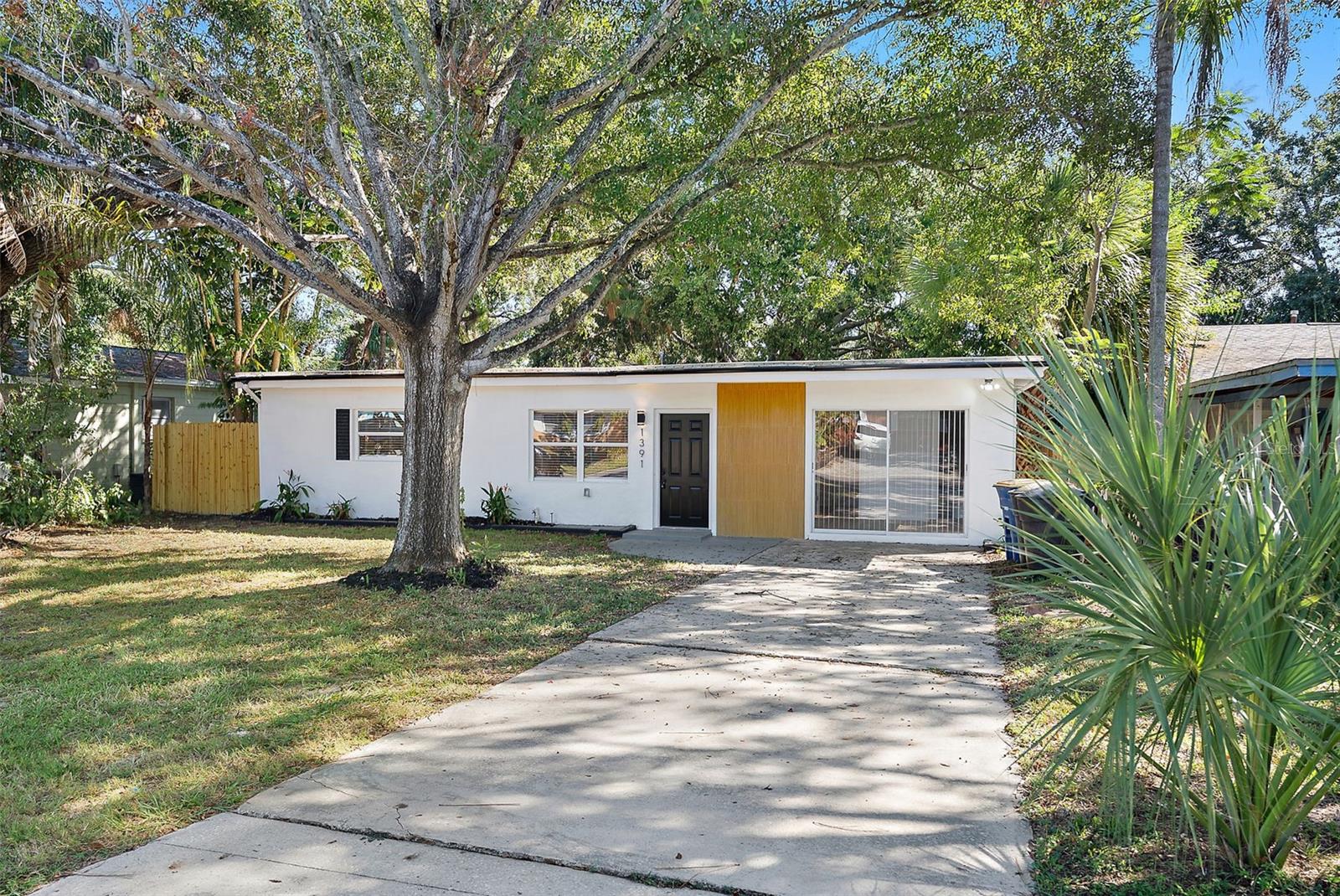 Beautifully remodeled and well-priced Clearwater home, featuring 3 bed, 2 bath + Bonus room and oversized detached workshop/shed. Enjoy the beach lifestyle with NO HOA and NO flood zone with plenty of storage for hobby goods! Home features a brand new electrical panel, new HVAC, TPO roof, modern kitchen and stylish bathrooms. Move-in ready and just minutes from Clearwater’s world-famous bright sand beaches! Large backyard with mature oak trees providing plenty of shade!
