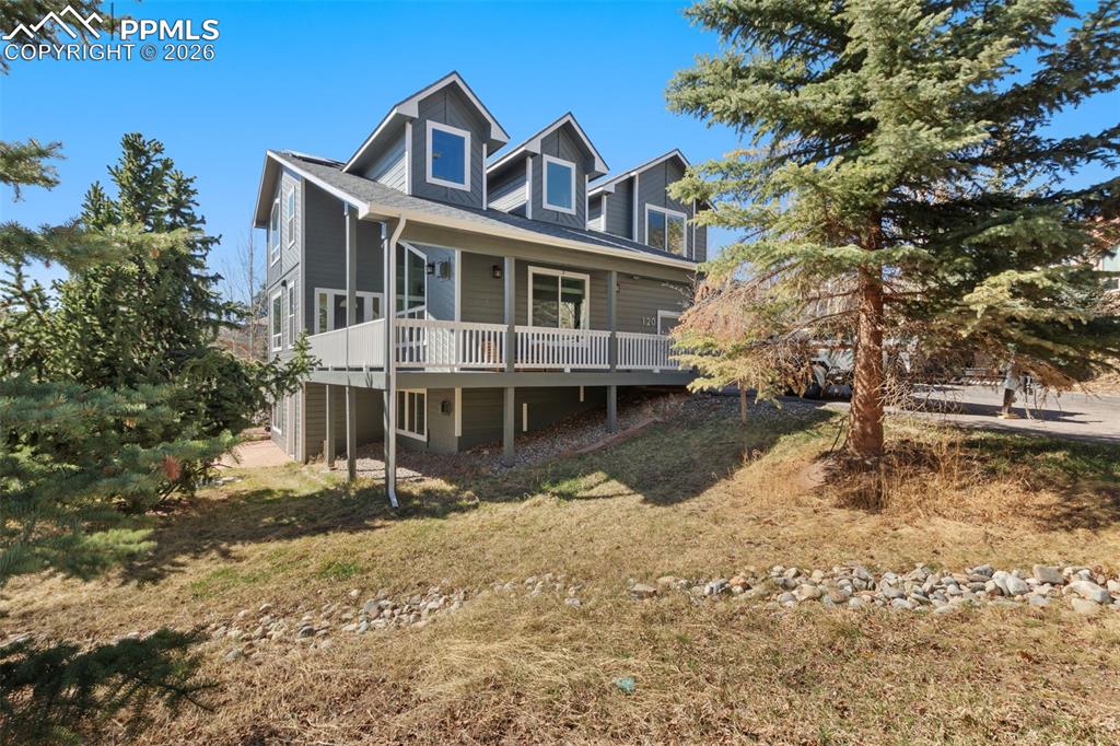 Welcome to this beautifully updated 5-bedroom, 4-bathroom mountain retreat tucked away on a peaceful cul-de-sac with stunning mountain views in the heart of Woodland Park. With views from the primary suite, dining room, living room, and wraparound porch, this home blends serene Colorado living with modern comfort and convenience. Inside, a bright open floor plan showcases rich hardwood floors, soaring vaulted ceilings, expansive windows, and powered blinds, allowing you to easily control natural light throughout the home. The updated gourmet kitchen features granite countertops, stainless steel appliances, a convection oven, and a cozy breakfast nook, opening seamlessly to the spacious living room with a warm fireplace—perfect for entertaining or relaxing after a day in the mountains. Upstairs, the luxurious primary suite offers breathtaking views, a large walk-in closet, and a spa-inspired bathroom with a soaking tub and separate glass shower, while two additional bedrooms provide flexible space for family, guests, or a home office. The finished walk-out basement adds incredible versatility with two additional bedrooms and a spacious multipurpose living area, ideal for guests, recreation, a home theater, or hobby space. Technology enthusiasts will appreciate the top-of-the-line networking system with a dedicated equipment cage and direct-connect homerun wiring for exceptional connectivity. Outdoor living shines with a two-tier composite deck, a large kids playground, invisible dog fence, and a hot tub, creating the perfect place to relax under the Colorado sky. Additional upgrades include fresh exterior paint, new windows, new carpet, solar panels for energy efficiency, a whole-house fan, and a furnace installed in 2021—making this home truly move-in ready. Located minutes from parks, trails, and Woodland Park’s vibrant town center, this property offers the best of mountain living with everyday convenience—your Colorado basecamp for adventure and lasting memories.
