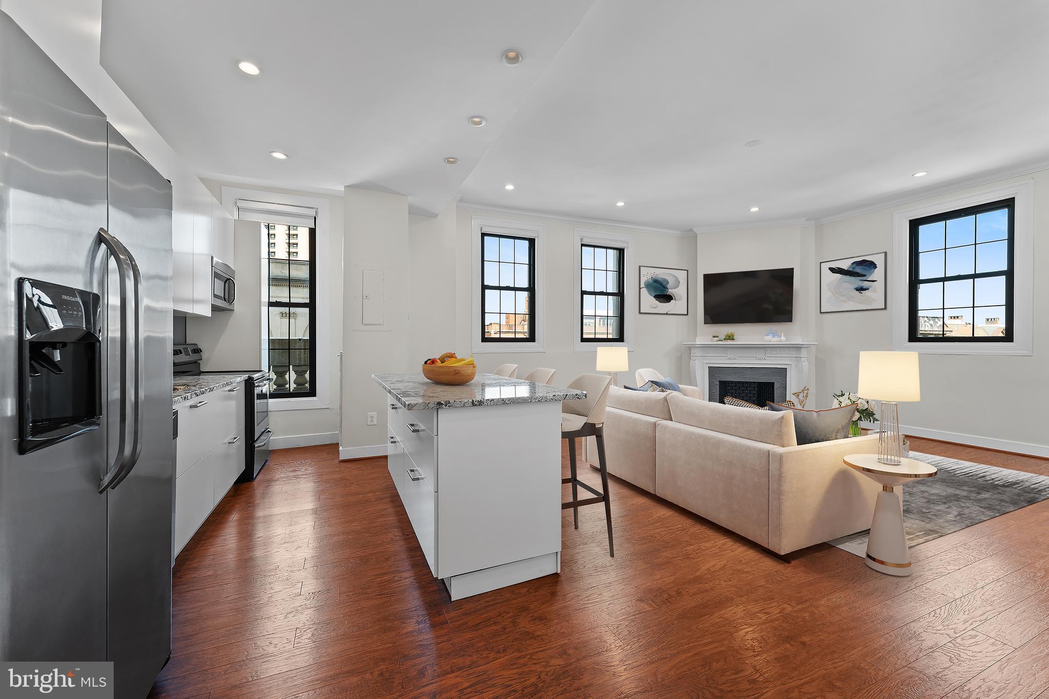 Welcome home to the iconic The Belvedere, where historic charm meets modern luxury. This beautifully maintained and fully renovated 2-bedroom, 2 full bath residence offers sophisticated city living at its finest. Renovated from wall to wall, this stunning condo features an expansive open-concept layout, a beautifully designed kitchen with a spacious island, granite countertops, stainless steel appliances, and the added convenience of an in-unit washer and dryer—perfect for effortless everyday living. Enjoy two tastefully renovated bathrooms, generously sized bedrooms with soaring ceilings, a charming decorative fireplace, and an abundance of natural light that fills the home throughout. Residents of The Belvedere enjoy 24-hour lobby service for added security and convenience, along with access to the building’s remarkable historic amenities, including grand ballrooms, the elegant John Eager Howard Room, the legendary Owl Bar, a 13th-floor lounge with breathtaking city views, and a unique lower-level shopping arcade. Ideally located near some of Baltimore’s finest dining, shopping, entertainment, and everyday conveniences, this is urban living at its absolute best. Schedule your private tour today!