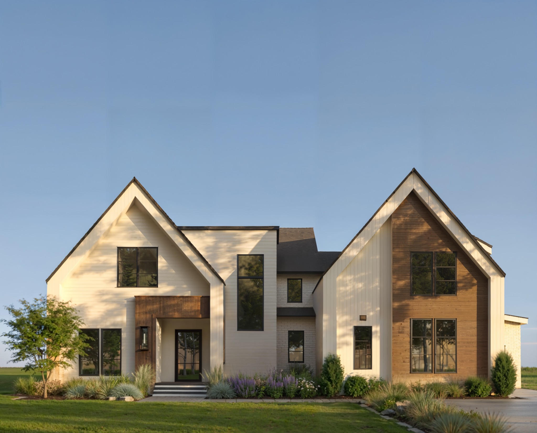 Modern Scandinavian design meets luxury living in Boura, Murfreesboro’s premier high-end community.This architecturally striking home is defined by clean lines, warm wood tones, layered neutrals, and intentional lighting throughout. The exterior showcases a refined Amarillo White, Buckskin and Oak brown palette with dramatic up/down lighting and a statement pivot front door that creates an unforgettable first impression.Inside, herringbone-pattern wood flooring anchors the main living spaces, while a stunning vertical wood slat feature wall with integrated LED lighting highlights the foyer and conceals a private office entry for a seamless architectural look. The stunning wood staircase with glass railing and illuminated treads serves as a true design centerpiece.The kitchen blends warmth and sophistication with custom cabinetry, Calacatta Gold-inspired countertops, champagne bronze fixtures, designer island pendants, and layered recessed lighting. The adjoining dining and great room spaces feature architectural built-ins, a sleek fireplace wall with integrated lighting, and cohesive finishes that create a calm, elevated atmosphere ideal for both everyday living and entertaining.The primary suite offers a serene retreat with wood slat detailing, statement lighting, and a built-out fireplace wall with subtle LED accents. The spa-inspired bath includes a freestanding soaking tub, oversized 5x7 shower, 9-foot double vanity, tall linen storage, and curated tile selections that reflect Scandinavian simplicity and warmth.Additional highlights include designer powder rooms, a dedicated pool bath with changing station, an upstairs workstation with integrated lighting, a bonus room with architectural LED ceiling detail, recessed baseboards, and modern interior hardware throughout.3368 Eslin Ct delivers warm minimalism, thoughtful craftsmanship, and refined modern design in one of Murfreesboro’s most exclusive neighborhoods.