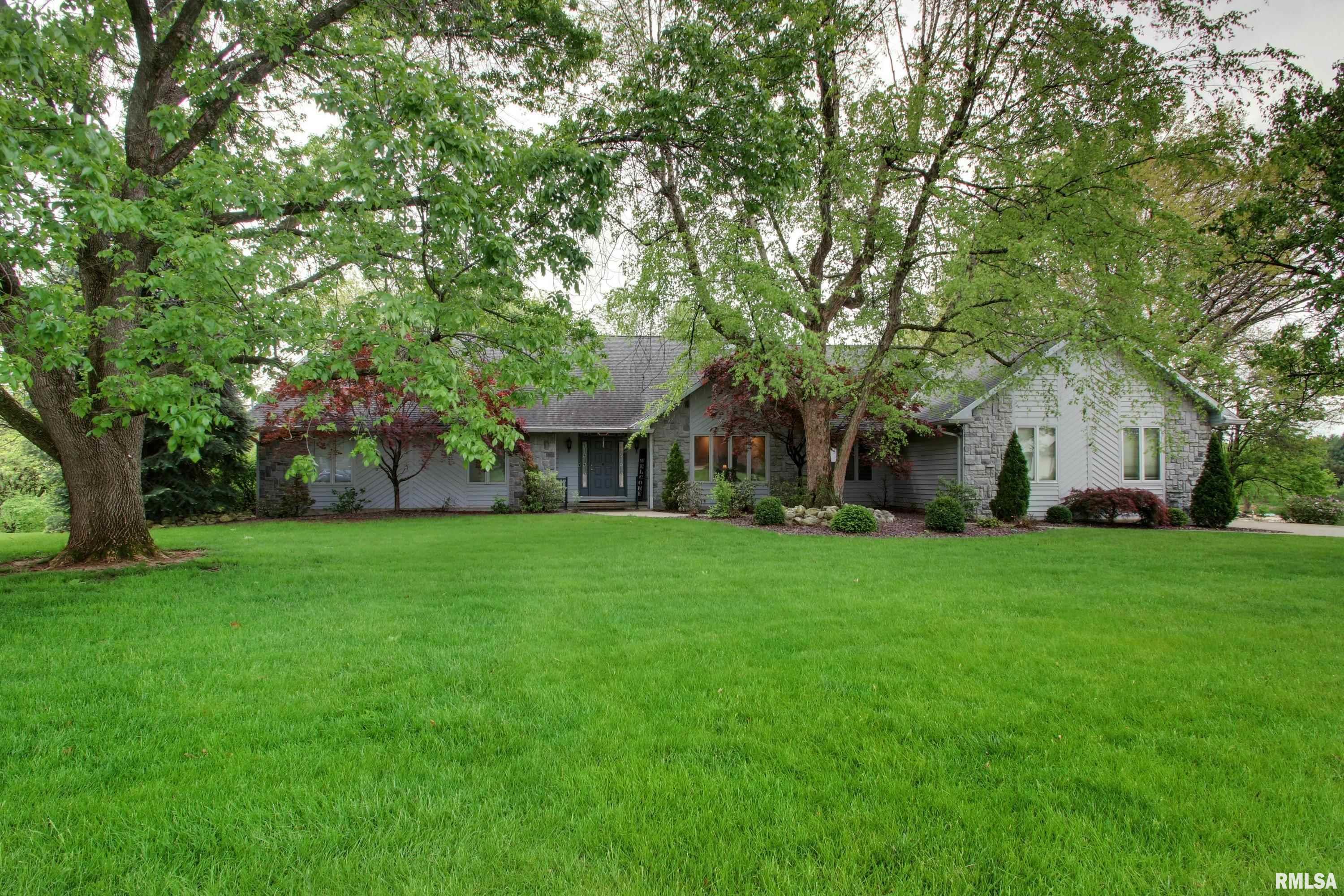 Really nice ranch home with a finished walkout lower level that also includes a fireplace and a wet bar. This home is located on a large well landscaped lot overlooking a beautiful Lake. The Lake has private use for the lots adjoining it only.  The lower level has been recently remodeled. This home is in a quiet lovely setting.