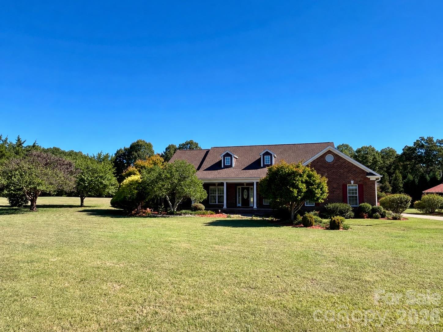 Over 2 acres of level land on a corner lot, with mature trees along the property line for privacy. Brand-new LVP flooring throughout and fresh new paint. The property also includes a large 22' x 48' outbuilding with a 2-car garage and finished workshop. Peaceful location yet with easy access to grocery stores, restaurants, and everyday essentials. Conveniently located just 7 minutes from Waverly Center and 15 minutes from Downtown Matthews.