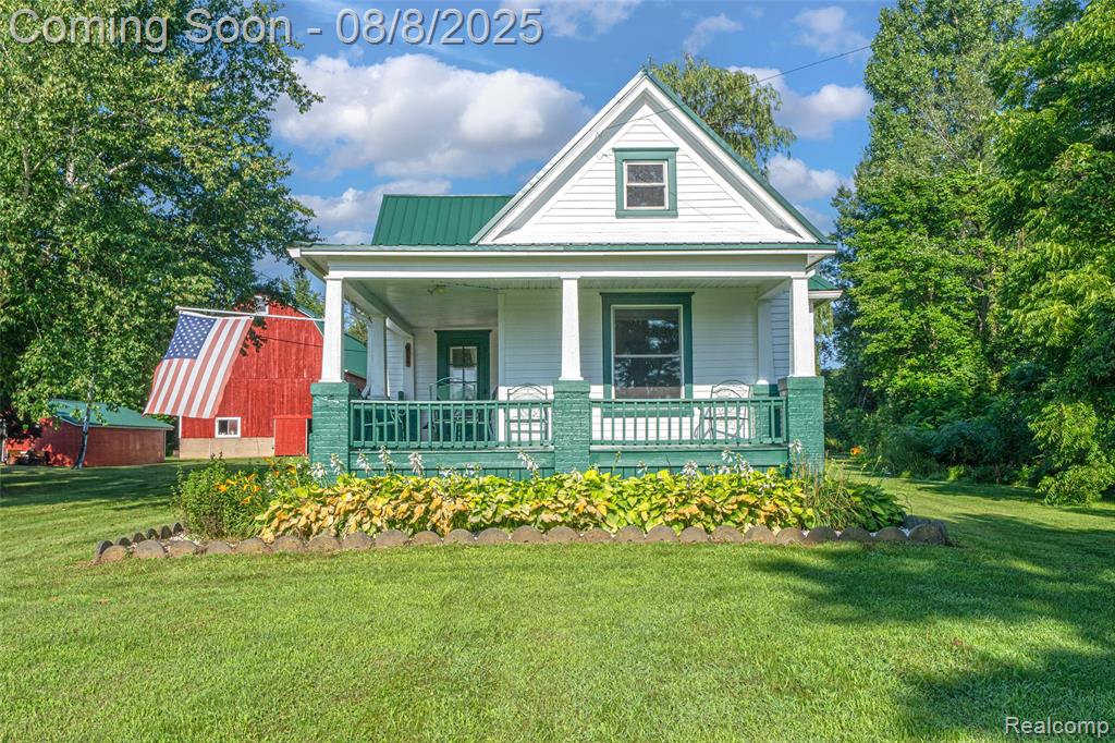 Welcome to 915 N. Van Dyke in Imlay City—a peaceful country escape nestled on 5.5 private acres with a pond and shared access to a picturesque 14-acre lake. Perfect for outdoor enthusiasts, the lake is fully stocked with a wide variety of fish, including largemouth and smallmouth bass, blue channel catfish, perch, crappie, sunfish, bluegill, walleye, and northern pike.  Whether you're casting a line, kayaking at sunset, or simply enjoying the view, this property offers year-round enjoyment.  A welcoming wraparound porch sets the tone for relaxed country living in this charming 3-bedroom, 1.5-bath home.  Inside, you’ll find a spacious den—ideal for a second living area or home office—and an open layout that flows seamlessly from the living room to the kitchen.  Modern updates throughout include all-new windows, a metal roof, updated HVAC, electrical, and plumbing systems, plus a new water softener.  The kitchen is both stylish and functional, featuring white cabinetry, sleek butcher block countertops, and new stainless steel appliances.  Outdoors, you’ll find a 30x40 Barn along with an additional Shanty-style building featuring a durable metal roof.  Whether you need extra storage, space for hobbies, or the ultimate man cave retreat, these versatile outbuildings offer endless possibilities.  With a blend of rustic charm and thoughtful upgrades, this property offers the perfect balance of comfort, character and adventure.  Schedule your showing today!!