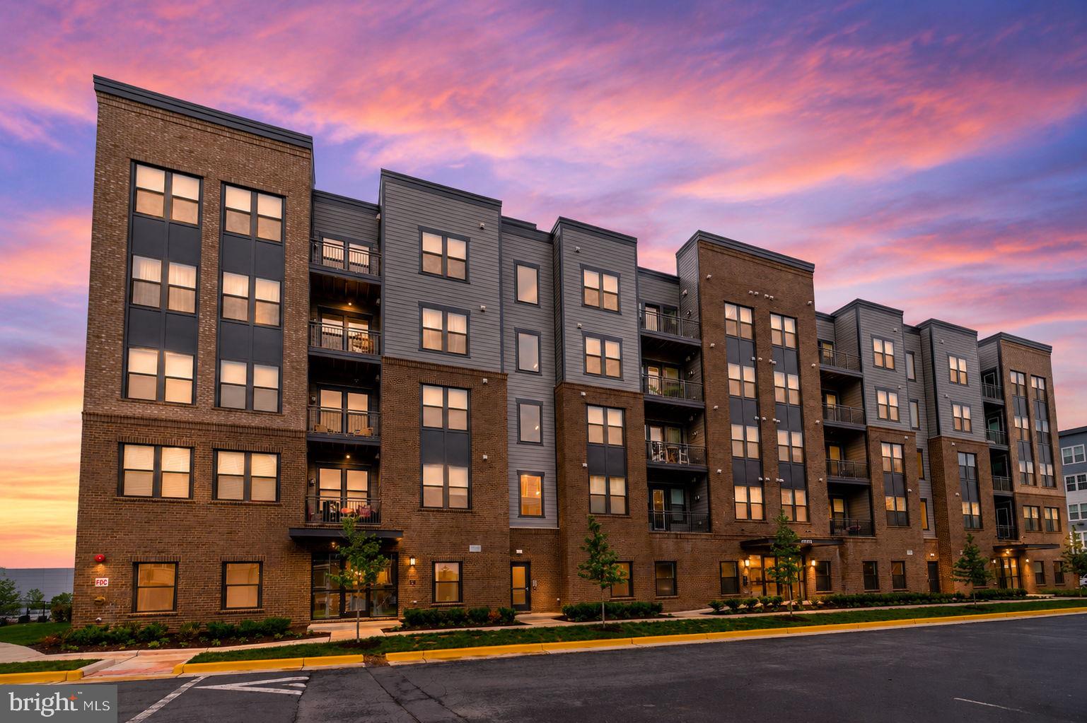 Experience upscale, low-maintenance living in this nearly brand-new condo at The Residence at Waxpool Crossing — ideally located just a mile from the Silver Line Metro, major commuter routes, shopping, dining, and everything Ashburn has to offer. Built in 2024 and delivered in 2025, this beautifully designed residence offers the benefits of nearly brand-new construction without the wait, delays, or builder premiums. Located on the 4th floor of a 5-story building, this 2-bedroom, 2-bath condo with a versatile den/office features a bright open-concept layout filled with natural light, creating the perfect balance of comfort, style, and functionality. The modern kitchen opens seamlessly to the spacious living and dining areas, making everyday living and entertaining effortless. The flexible den provides the ideal space for a home office or workout room — perfect for today’s lifestyle.The spacious primary suite offers a peaceful retreat with a large walk-in closet and a beautifully appointed en-suite bath. Enjoy the convenience of in-unit washer and dryer, elevator access, secure building entry, garage parking space #16, a large storage bin #9, and a true lock-and-leave lifestyle in one of Ashburn’s most desirable locations. Relax on your private balcony, enjoy easy access to the Metro, and take advantage of nearby parks, trails, restaurants, and retail just moments from your door. Rare opportunity to own one of the community’s most desirable floor plans, priced under $500K in the heart of Ashburn. Move-in ready and beautifully maintained — schedule your showing today!