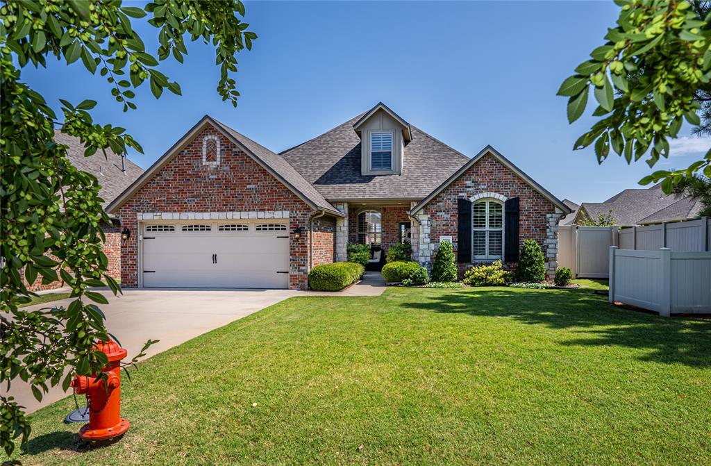 ABSOLUTELY IMMACULATE & MOVE-IN READY!!! This home is simply stunning! Pride in ownership shows! Gated Edmond community. New Class 3 roof installed October 2023! Water heater replaced in 2024! Front landscaping in 2024! Garage door opener in 2022! Updated hardware in kitchen, baths & utility room. Updated light fixtures!  3 beds all downstairs. Upstairs features a bonus room with wood floors, fan & closet--perfect game room, media room or workout room. Plantation shutters thru out the home!! Kitchen w/updated hardware, backsplash & dishwasher in 2022, granite counters, island, double ovens, breakfast bar & large pantry! Spacious family room w/updated fireplace , bookcase & wall of windows! Primary bed w/fan, wood floors, walk-in closet and full bath with walk-in shower, tub & granite vanity w/2 sinks. 2nd & 3rd bed both have wood floors, fan & walk-in closets. Hall bath w/tub & granite counter. Flexible room off living can either be used as home office or formal dining. Utility room with built-in desk w/granite & fabulous storage! Large covered patio faces East for relaxing evenings outside! Security & Spinkler. Community pool & playgroud! Edmond Schools and OKC Utilities! HOA dues cover mowing, street, gate, playground, pool & lawn fertilizing.