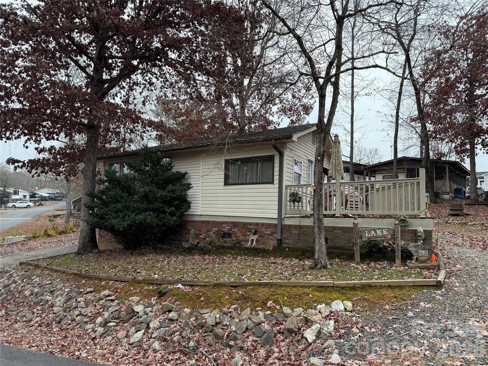Welcome to your "Lake Cottage" here in the park. This 1 bedroom and 1 bath unit is full of colors and fun. It comes fully furnished and ready for her new owner's. Large living room, flex space right at the door. Nice size dining area. Front end kitchen gives more space in kitchen, counters and cabinets. Good storage in camper. Some concrete, metal carport, 2 storage buildings. The lot is an interesting shape. All buyers must be with a realtor to gain entry to the community. Come and see if this could be your "Happy Place" here in Twin Harbor. No title, Bill of Sale will be provided.