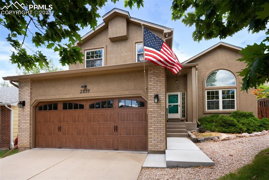 Nestled in the scenic foothills on the highly sought-after west side of Colorado Springs, this stunning single-family home is a true mountain retreat that effortlessly combines modern comfort with breathtaking natural beauty. Backing directly to the majestic Pike National Forest, you’ll enjoy endless hiking adventures right from your backyard—just walk out the back gate to the trailhead and immerse yourself in nature while soaking up incredible views of Blodgett’s Peak and the Rampart Range.  This spacious 5-bedroom, 4-bath gem welcomes you with vaulted ceilings, an inviting gas fireplace with under-mantel lighting, elegant hardwood and LVP flooring, and fresh interior paint throughout. The bright, open kitchen features granite countertops, composite sinks, Bosch dishwasher, touch faucet, pantry, and a charming shiplap plank ceiling. Arched doorways and recessed can lighting add a touch of sophistication, while ceiling fans, central AC, and humidifier keep you comfortable year-round.  Upstairs, the master suite is your private sanctuary boasting a luxurious 5-piece bath with a jetted tub, walk-in closet, and Juliet balcony. Bedrooms features plant shelves, and the home has several automatic shades for added style and convenience.  Step outside to your large composite back deck complete with an impressive 18-foot retractable awning—ideal for outdoor dining or simply watching the abundant wildlife wander just beyond your fence. Relax on the flagstone patio area or entertain with ease thanks to the built-in Bluetooth speaker system. Practical upgrades include a 50-gallon water heater, epoxy-finished garage floor, durable stucco exterior, and CAT 6 wiring throughout for modern connectivity.  Only 1.5 miles to Ute Valley Park too - great location! With stunning mountain views from nearly every angle and countless trails to explore, this is Colorado living at its finest. Don’t miss your chance to own a piece of paradise in the heart of the foothills!