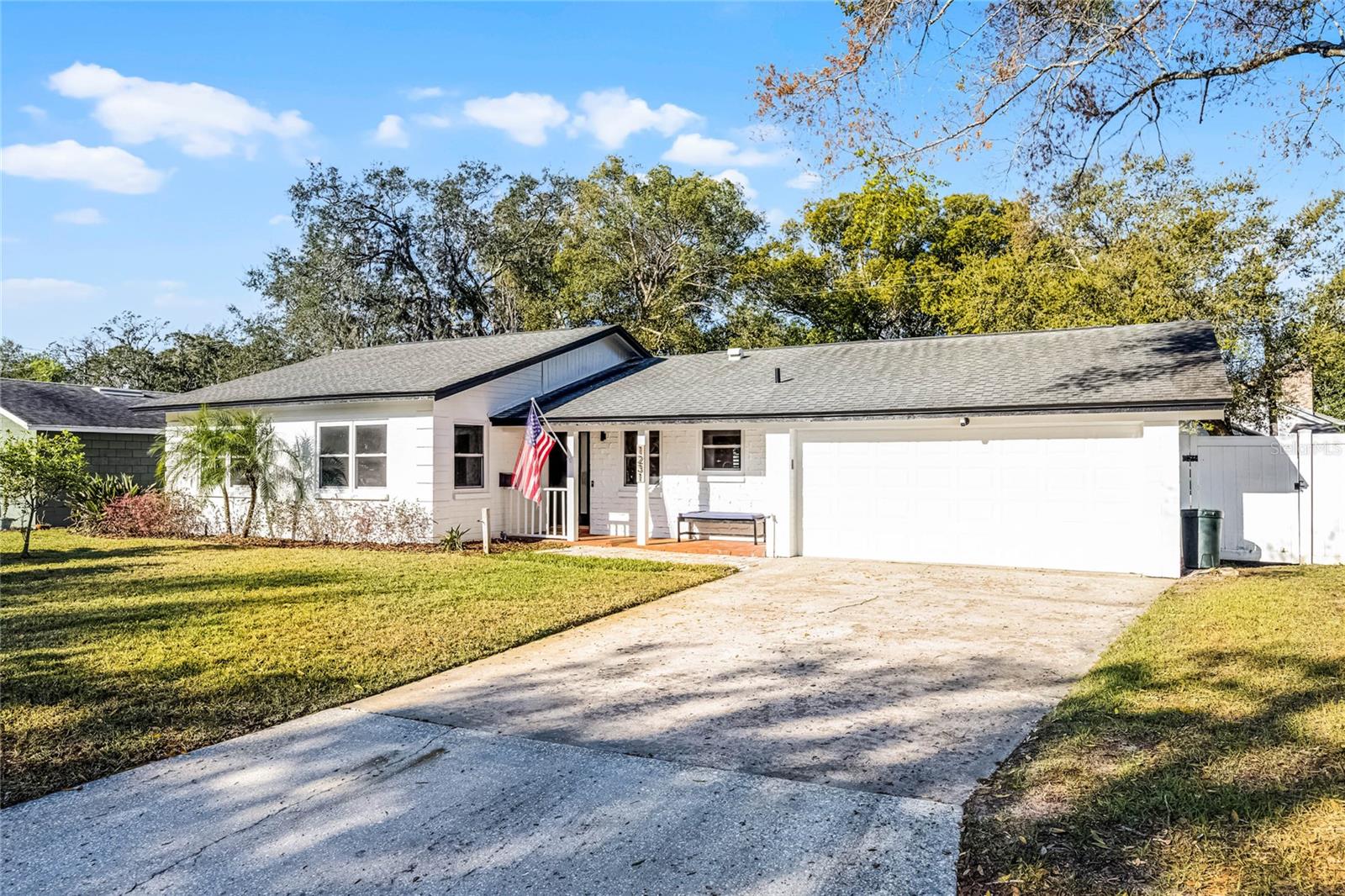 One or more photo(s) has been virtually staged. Don’t miss this beautifully updated 3-bedroom, 2-bathroom English Estates pool home with a versatile bonus room that can serve as a 4th bedroom, office, gym, or playroom—complete with its own private entrance. Priced below appraised value, this home is packed with thoughtful upgrades and modern conveniences. The exterior boasts fresh paint, updated lighting, and a charming covered front patio with classic brick accents, offering great curb appeal. Inside, you'll find new interior paint, crown molding, plantation shutters, floating wood floors, and newer windows throughout, creating a bright, welcoming space. The updated kitchen is both functional and stylish, featuring stainless steel appliances, granite countertops, decorative tile backsplash, a built-in desk, and an open layout that flows seamlessly into the family and dining rooms. French doors lead you out to a spacious screened-in pool area, perfect for entertaining or relaxing, with adjacent patio perfect for grilling and enjoying the Florida lifestyle. Smart home features include: smart interior lighting to control ceiling lights/fans, etc., from your phone; a smart thermostat; doorbell; smart locks; smart garage door; smart remote blinds in kitchen & office; wired security cameras; and a Tesla EV charger in the attached garage. Additional upgrades include a new pool pump, new window blinds, new light fixtures, a tankless hot water heater, updated electrical, PVC plumbing, 2017 roof and 2022 HVAC system. The garage also offers a storage closet and a climate-controlled laundry room. With a fenced side yard and dedicated dog run, as well as fiber internet availability for those working from home, this property combines style, function, and unbeatable value in one exceptional package. Convenient location in the heart of Maitland, with easy access to Maitland Community Park, Maitland City Centre, the SunRail, and minutes to I-4.