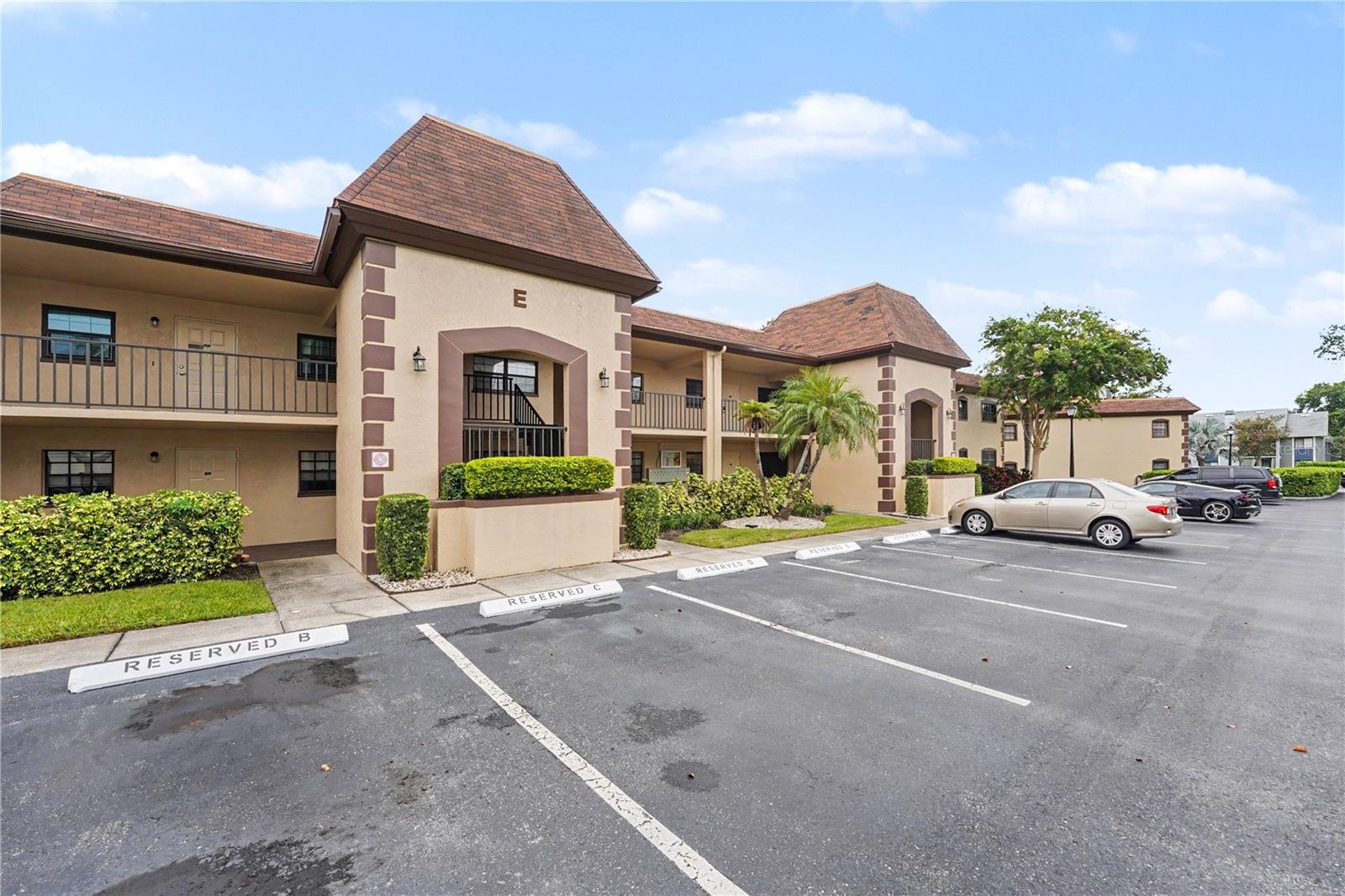 Welcome to easy coastal living in this bright, beautifully updated Southwest Largo condo with no 55+ age restriction! Just minutes from Gulf shores! This beautifully maintained community offers one of the lowest area HOA dues of only 530 per month, which includes insurance, water, cable, internet, sewer and trash. The standout, a versatile enclosed lanai has upgraded floor-to-ceiling, double-pane sliding storm rated windows. Open them for fresh-air patio living or close them to enjoy a comfortable extension of the living space year-round. The updated kitchen features brand-new Samsung Wi-Fi smart range/oven, slimline microwave and ultra-quiet dishwasher w/ a bonus 3rd rack. Additional peace of mind comes from the newer A/C system and water heater, both replaced in 2020. Featuring in-unit laundry that includes the washer and dryer as well. The oversized primary suite offers lanai access and an impressive walk-in closet with custom shelving as does the guest closet. The bathrooms offer both function and style with beautiful tempered glass doors and other thoughtful updates. Relax and unwind at the clubhouse, complete with a sparkling pool, restrooms, and an outdoor shower. This unit includes a designated owner’s parking space, along with ample guest parking. Located in Flood Zone X with no lender-required flood insurance. Directly across the street, Largo Southwest Recreation Center offers fitness facilities, tennis, pickleball and an Olympic-size pool. Walk to Largo Public Golf Course and enjoy quick access to beaches, parks, dining and shopping. Schedule you private showing and discover paradise with white sandy beaches!
