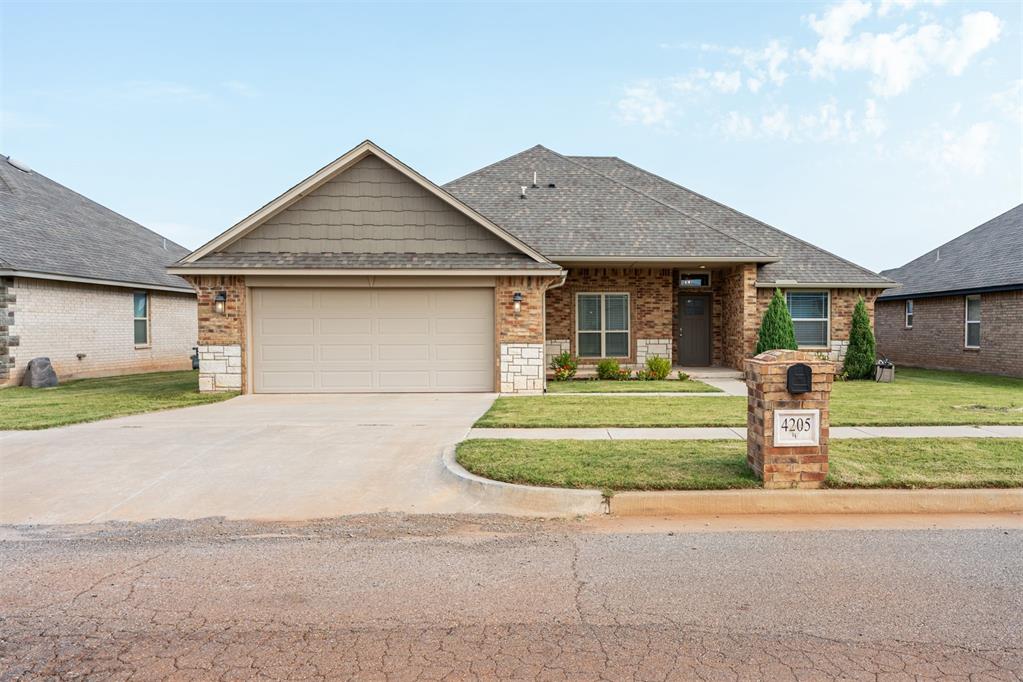 Incredible opportunity in Lone Oak East—where timeless design meets everyday comfort.

Set on a spacious lot with a large backyard that backs up to a greenbelt, this home immediately welcomes you with its beautiful garden, trees, and an inviting covered front porch perfect for morning coffee or evening conversations.

Inside, fresh light paint colors and wood-look tile floors create a bright, clean, and welcoming entry. Natural light pours in, highlighting tall ceilings and an open floor plan that’s ideal for both entertaining and relaxed everyday living. The living room is anchored by a cozy gas fireplace, setting the stage for warm gatherings year-round.

At the heart of the home, a thoughtfully designed kitchen blends function with style. Stainless steel appliances, quartz countertops, and a stainless farmhouse sink pair beautifully with a subway tile backsplash and under-cabinet lighting. A dedicated pantry, coffee bar, and spacious dining area add those extra touches that make life easier and more enjoyable.

With three bedrooms plus a dedicated office that could easily serve as a fourth, there’s room here to grow and adapt to your needs. The primary suite feels like a retreat, featuring a double vanity, walk-in shower with rainfall head, soaking tub, and a huge walk-in closet.

Step outside to enjoy a large backyard oasis, perfectly framed by the peaceful greenbelt beyond. Whether it’s kids playing, pets exploring, or hosting weekend cookouts, this space is ready to be enjoyed. The home also comes equipped with a storm shelter for added peace of mind.

Life in Lone Oak East brings even more to love with access to a neighborhood pool and playground, making it easy to connect with neighbors and enjoy the community.

If you’ve been waiting for a home that checks all the boxes—charm, function, and a welcoming neighborhood—this is it. Schedule your showing today and experience it for yourself.