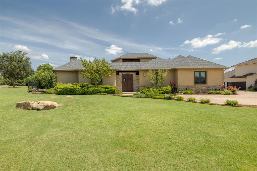 Experience the rare opportunity to own one of the largest lots in prestigious, guard-gated Rose Creek! This .54-acre cul-de-sac property offers unmatched privacy with no homes in front and a stunning ivy-lined courtyard with cozy fire pit at the heart of the home, creating an inviting focal point visible from multiple rooms and accessible from the kitchen, office, and guest suite. Designed for entertaining, the open living, dining, and kitchen area blends warmth and elegance with rich hardwood floors, wood beams, a soaring stone fireplace, and walls of windows overlooking the lush, manicured side yard. The gourmet kitchen is a chef’s dream with a huge breakfast bar, double ovens, built-in refrigerator, commercial-grade gas cooktop, wine fridge, and a massive walk-in pantry, plus both patio and courtyard access for seamless indoor/outdoor living. The spacious primary suite is a private retreat with a spa-like bath offering dual vanities, jetted tub, walk-in shower, and a large closet that connects to the oversized laundry room with abundant storage. An office with courtyard access sits just off the primary, while two bedrooms on the opposite wing share a full bath, with one enjoying its own courtyard access. Upstairs, discover a versatile bonus/media room with full bath, bar with sink and ice maker, and a private balcony boasting serene views of the courtyard and Rose Creek Golf Course—perfect for morning coffee or sunset cocktails. Additional features include a 3-car garage with storm shelter, new roof (2024), and two tankless water heaters (one brand new). Rose Creek residents enjoy 24-hour security, an award-winning clubhouse & restaurant, the upcoming private club “The Retreat,” Aquatic Center, fitness facility, playgrounds, and pickleball courts—offering an unparalleled blend of luxury, comfort, and community.