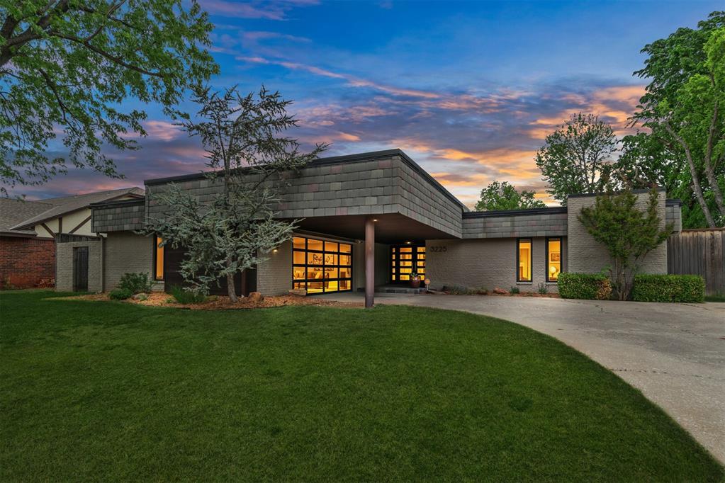 Welcome to this contemporary home in Quail Creek! This home offers 4 beds, 2.5 baths, large living area, updated kitchen and 2 dining areas + a great covered patio!  The double glass front doors welcome you into this mid-century style home featuring four spacious bedrooms and an emphasis on light & simplicity. Characterized by its low-pitched rooflines, expansive windows, and open floor plan, the home invites natural light into every corner. The main living area showcases a bright, airy layout with lots of windows, slate front fireplace, warm wood floors and clean architectural lines. The  living room flows effortlessly into the dining area and a sleek, modern kitchen outfitted with white cabinetry, center island with gas cooktop & eat in area, double ovens, and built in desk area plus a smaller dining space with doors to the patio. The laundry area offers plenty of space for storage and access to the garage. Down the hallway is a classic 1/2 bath plus 3 well sized bedrooms & a Jack & Jill bath with double sinks, tub & shower combo with glass doors. At the end of the hallway is the oversized primary suite with a nice primary bath offering soaker tub, separate shower, double sinks and walk in closet. Outside enjoy the summer breeze under the covered patio! This home is ready for its new owner to enjoy all Quail Creek has to offer!