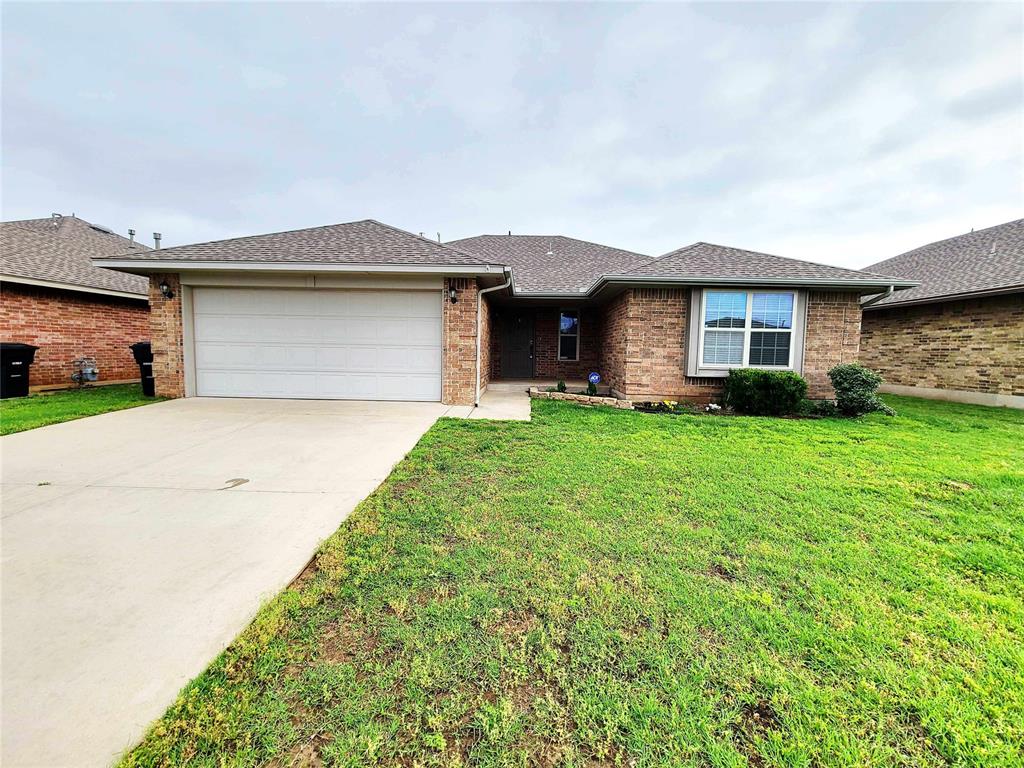 Welcome to this charming home located in the desirable Moore Schools district! This three bedroom, two bath home offers a spacious living area with vaulted ceilings and a cozy fireplace. The kitchen features tiled countertops, plenty of cabinet space, a mounted microwave, and a refrigerator. The primary suite includes a private bathroom and a large walk in closet. Outside, enjoy a spacious back patio and fully fenced yard, perfect for relaxing or entertaining. Additional features include a storm shelter and a two car garage. Convenient, comfortable, and ready to call home. Schedule your showing today!