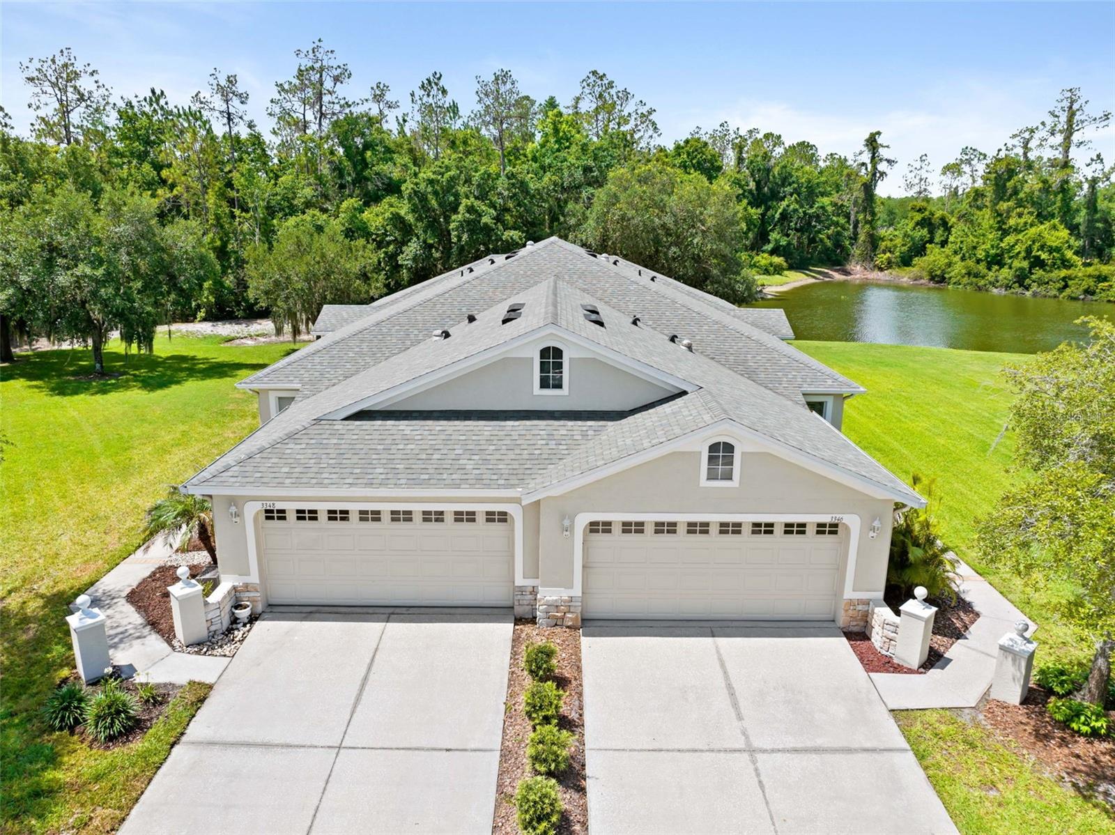 Welcome to Willow Creek at Seven Oaks in Wesley Chapel! This beautifully maintained single-story villa offers 3 bedrooms, 2 bathrooms, a 2-car garage, and the low-maintenance Florida lifestyle buyers are looking for in one of Wesley Chapel’s most desirable gated communities.Step inside to a bright, open floor plan with spacious living and dining areas, a comfortable kitchen with plenty of cabinet and counter space, and a private primary suite with a walk-in closet. The home features tile and laminate flooring throughout the main living areas, primary bedroom, and one secondary bedroom, with carpet only in the back bedroom. Buyers searching for no carpet in the main living areas will appreciate the easy-maintenance flooring, functional layout, and everyday comfort this villa provides. The secondary bedrooms offer excellent flexibility for guests, a home office, hobby room, or additional living space.Enjoy morning coffee or quiet evening relaxation from the screened lanai overlooking the peaceful conservation area with no rear neighbors. The extendable awning adds shade and comfort, creating a private outdoor living space perfect for enjoying Florida weather.The HOA helps create a truly carefree lifestyle by covering exterior maintenance, lawn care, landscaping, roof, and exterior painting. Buyer to verify all HOA coverage and restrictions.Residents of Willow Creek enjoy their own private community pool, plus access to the exceptional Seven Oaks amenities, including resort-style pools, clubhouse, fitness center, tennis courts, playgrounds, parks, sidewalks, and walking trails. Conveniently located near SR 56, I-75, Wiregrass Mall, Tampa Premium Outlets, The Grove, KRATE, AdventHealth Center Ice, BayCare Hospital Wesley Chapel, AdventHealth Wesley Chapel, restaurants, shopping, and dining.This Seven Oaks villa combines location, lifestyle, conservation views, gated-community living, no rear neighbors, and low-maintenance convenience in the heart of Wesley Chapel. Schedule your private showing today!