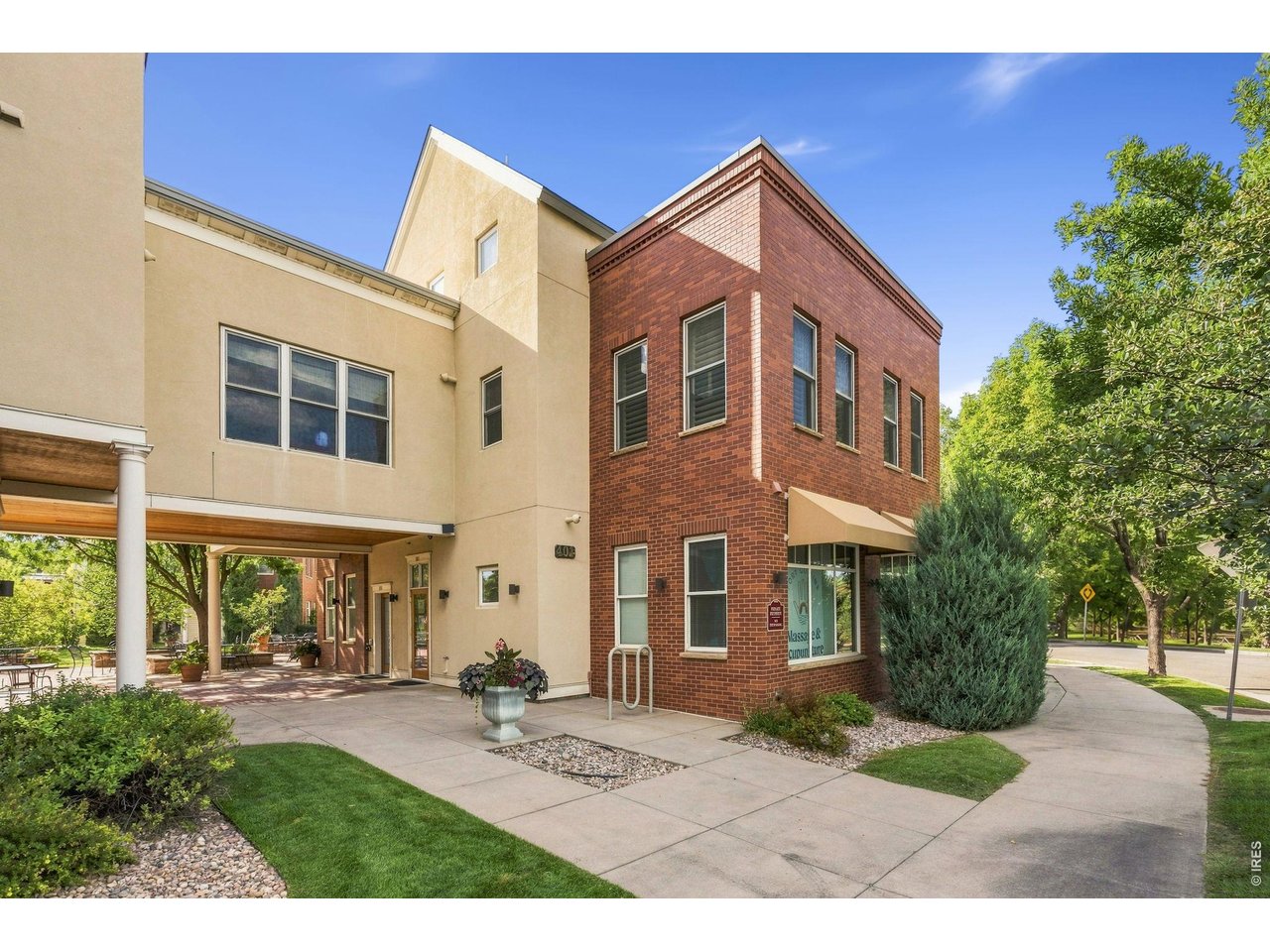 Elevated living in an exceptional Old Town West location. Experience the best of Fort Collins from this beautifully updated 3-bedroom, 2-bathroom condo offering an exceptional walkable location, and a rare oversized upper-level deck with views overlooking portions of Lee Martinez Park and the Poudre Trail. Set in Mason Street North Condos, this spacious residence puts Old Town dining, shopping, breweries and entertainment within an easy stroll. The Discovery Science Museum is located next door and immediate access to the Poudre Trail including miles of trails and open space. CSU main campus is close by. Inside, an inviting, updated interior offers fresh paint throughout, upgraded light fixtures, oak engineered wood flooring and new carpet in the bedrooms and at the stairs. The well-appointed kitchen offers slab granite countertops, ceramic tile backsplash and stainless steel appliances, including a gas range/oven, refrigerator and dishwasher. All appliances are included for an easy move. Generous living spaces and three bedrooms provide flexibility for guests, a home office, or additional living space. The private primary retreat on the second level offers a peaceful escape with vaulted ceilings, expansive windows framing views toward Lee Martinez Park and a cozy gas fireplace. A spacious walk-in closet provides generous storage, while the private ensuite bath completes this inviting retreat. Luxurious plantation shutters. Both bathrooms have been nicely upgraded, along with numerous other improvements including replacement window glass throughout, new hot water heater and a new gas forced heat furnace with air cleaner, humidifier and central air conditioning. One of the home's standout features is the expansive upper deck-an impressive extension of the living space with room for outdoor dining, entertaining or simply relaxing while taking in the park setting. A detached 1-car garage is included in the sale and extra parking is also available.