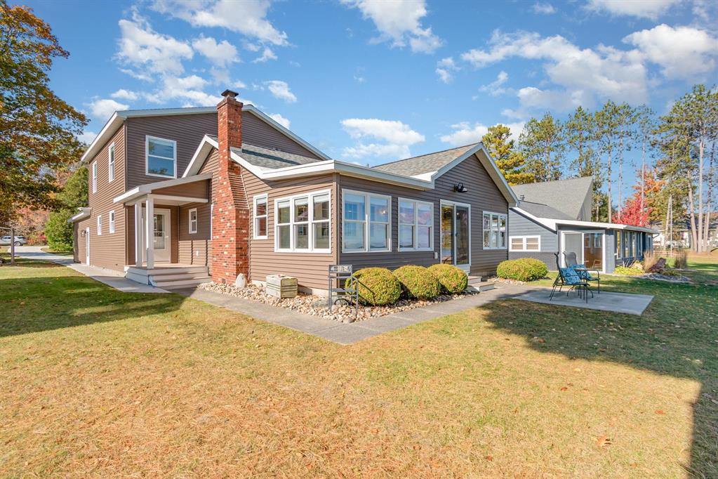 Stunning Lake Huron Waterfront Home - Updated, Spacious & Serene. Experience the best of lakeside living in this beautifully updated 3,100+ sq. ft. home with 50 feet of deeded sandy beachfront on Lake Huron. Perfectly situated on a peaceful dead-end road in a quiet tucked-away neighborhood, this rare find offers the ideal balance of privacy, convenience, and breathtaking views, all just minutes from town and steps from the scenic bike path. Enjoy sweeping panoramic views of Lake Huron, Tawas Point, and passing freighters from the bright and sunny lakeside sunroom-a year-round gathering space where natural light pours in through floor-to-ceiling windows. Step outside to experience bonfires on the beach, paddleboarding, kayaking, or simply relaxing to the sound of gentle waves and lake breezes. Thoroughly remodeled in 2020, this home was thoughtfully designed to capture the charm and craftsmanship of days past while featuring the comfort and efficiency of modern living. Updates include: New roof, vinyl siding, and septic system with drain field. All-new plumbing, insulation, and double-hung tilt-in vinyl windows. New central air conditioning and wiring for a whole-house generator. New appliances and maintenance-free porches. Drywalled, well-lit garage with cement driveway and sidewalk. Inside, the spacious layout provides flexible living and entertaining areas, including a main-floor bedroom, bath, and laundry for added convenience. The large kitchen and open gathering spaces make hosting effortless, while a bonus room offers space for hobbies, gaming, or additional sleeping quarters. The cozy family room-complete with a wood-burning fireplace and knotty pine accents-blends warmth and character throughout. With city water, natural gas, central air, and abundant storage, this home is as practical as it is beautiful. Whether youre seeking a peaceful year-round residence or a private lakeside retreat, this property delivers the lifestyle youve been dreaming of.