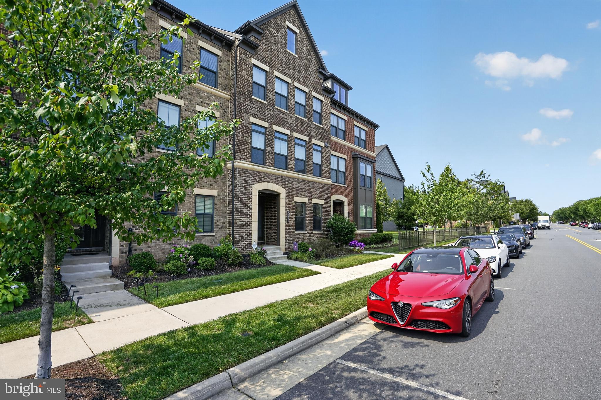 Beautifully staged and loaded with premium upgrades, this stunning Ballston Loft model offers sophisticated, modern living in one of the area's most desirable communities. This spacious four-level townhome features approximately 3,443 square feet of thoughtfully designed living space with 4 bedrooms, 3 full baths, and 2 half baths.The open-concept floor plan is filled with natural light and showcases designer finishes, high ceilings, and contemporary details throughout. The gourmet kitchen flows seamlessly into the spacious living and dining areas, creating the perfect setting for both everyday living and entertaining.The luxurious primary suite provides a private retreat with a spa-inspired bath and generous walk-in closet. Additional bedrooms offer flexibility for family, guests, or a home office.Enjoy the convenience of an attached two-car garage, modern construction, and low-maintenance living. Every level has been carefully designed to maximize space, functionality, and style.Beautifully maintained and move-in ready, this exceptional home combines elegant design, premium finishes, and an unbeatable lifestyle. Conveniently located near shopping, dining, parks, major commuter routes, and the Metro, this is a rare opportunity to own one of the most sought-after Ballston Loft models in the community.