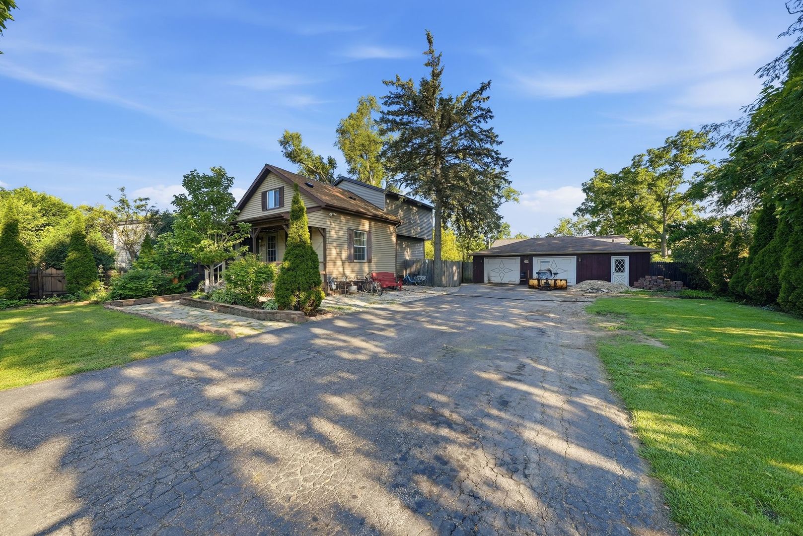 Welcome to 2007 W 34th St, a beautifully updated home situated on a double lot spanning over half an acre. This property offers incredible versatility with a huge, heated 5-car garage and parking for over 12 vehicles. Step inside to discover an updated kitchen completed in 2026, along with a newer water heater (2026), roof and siding less than 5 years old, and a furnace/AC system from 2017. The home features 4 bedrooms and 2 bathrooms, plus a partially finished basement offering abundant storage space. Enjoy the expansive yard, perfect for entertaining, gardening, or bringing your outdoor vision to life. A rare combination of space, updates, and potential - schedule your showing today!