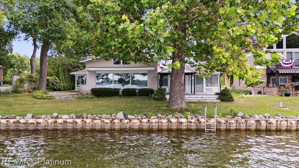 Still Plenty of Summer to Enjoy! Discover this sprawling Mid-Century ranch located on highly sought-after all-sports Lake Fenton, with additional frontage on serene Hidden Lake. Freshly updated with new flooring, paint, and a modernized kitchen, this spacious home offers an ideal blend of comfort and style. Enjoy the expansive layout featuring a Dining Room, Lake Room, Florida Room, and a Primary Bedroom with en-suite bath—plus a convenient Laundry Room. A detached 3-car garage includes a second story with a balcony, perfect for entertaining or taking in peaceful views of swans, turtles, beavers, ducks, and more—nature lovers, take note! Located near the center of Lake Fenton in the quiet “no wake” zone head, you’ll experience the perfect mix of tranquil waters and scenic beauty. Don't miss your chance to own a lakefront gem with amazing views and direct access to two lakes!
