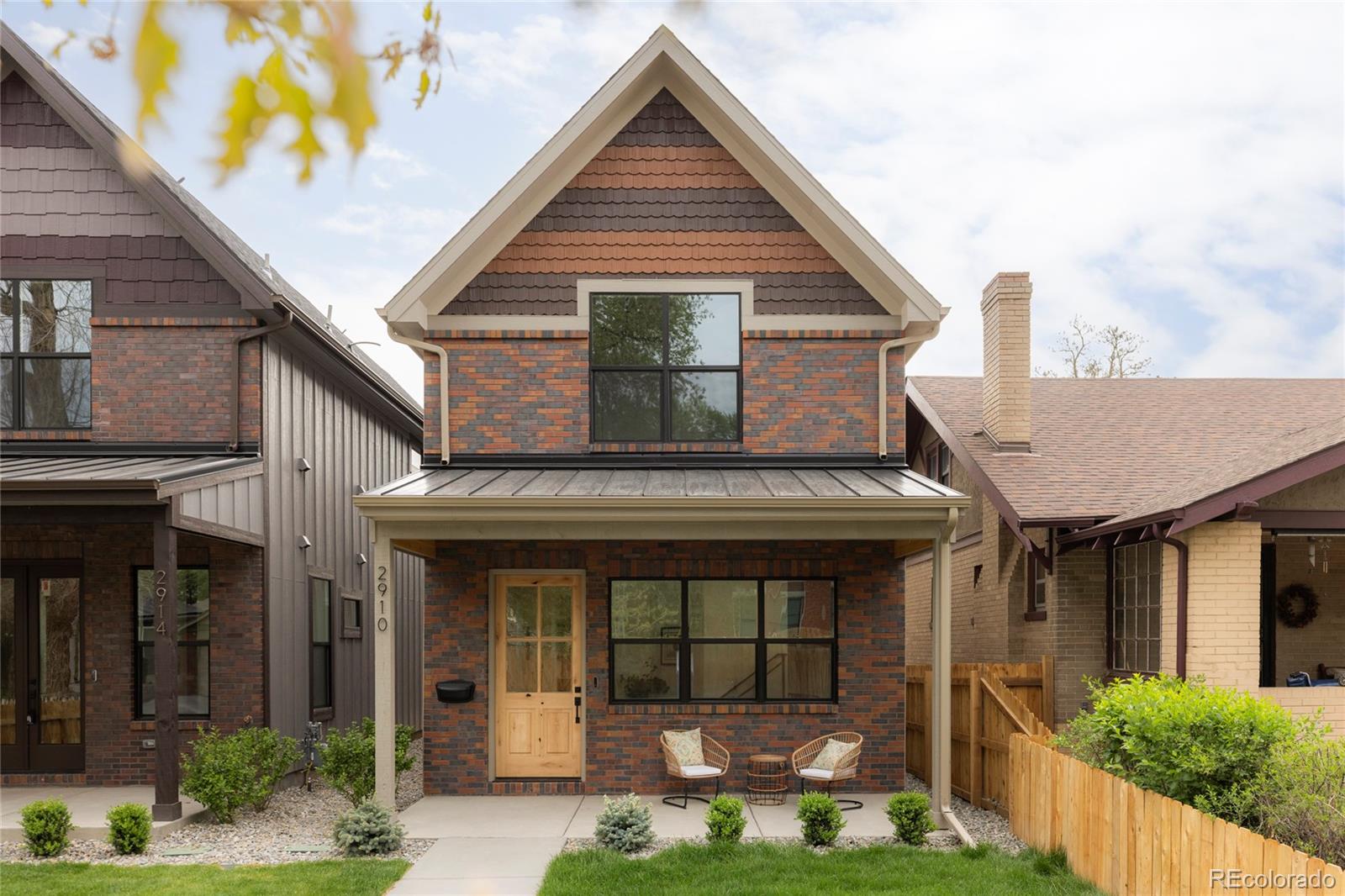 Stunning new construction at 2910 Hooker St in Denver's vibrant West Highlands. Walk to the shops and restaurants on 32nd, and easy access to Sloan's Lake! This modern gem features a timeless brick facade that seamlessly blends with the neighborhood's classic architecture, and is sure to impress with every square foot creatively used.  Enjoy the open first floor plan with engineered hardwood floors centered around a chef’s kitchen, anchored by beautiful cabinets, quartz countertops, 48" dual fuel range, and a built-in paneled Jen Air refrigerator & freezer. The focus of the living room is the 42" gas fireplace with custom trim surround and oversized glass sliding doors leading to the backyard. The upstairs has 14' vaulted ceilings, engineered hardwood floors, 3 bedrooms, 2 bathrooms, and a laundry room. The luxurious primary suite flaunts a custom walk-in closet and 5-piece bath (walk-in shower, soaker tub, double vanities, private toilet). The carpeted basement has impressive 9' ceiling clearance and includes a large living room, kitchenette wet bar, two bedrooms(one non-conforming—ideal office/flex), dual-sink bathroom, and second laundry space. The backyard has a covered patio, a gas line for a grill, and a detached 2 car garage. Additional highlights include zoned thermostats per floor, central A/C, tankless water heater large front yard that can be fenced, and a one year builder warranty.