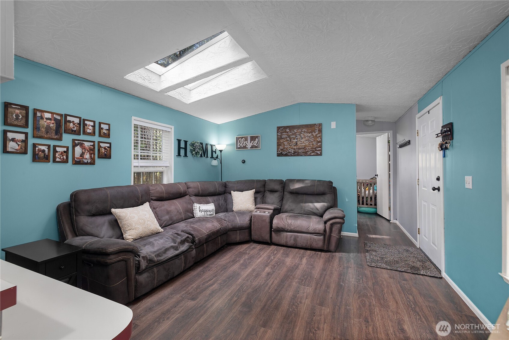 Nestled in the peaceful Hoodsport community, in Lake Cushman Division 5, this charming 2-bedroom, 2-bath home offers 924 sq ft of comfortable, move-in ready living surrounded by the beauty of the Pacific Northwest. Close to the Lake Cushman store, Golf Course, and Lake Cushman Dam. The interior features updated vinyl plank flooring, fresh interior paint, and new appliances—creating a clean, modern feel throughout.  Situated on a fully fenced lot, the property includes RV parking with partial hookups—ideal for guests or added flexibility. A gated access point leads to a serene creek behind the home, managed by DNR, providing a tranquil natural backdrop and added privacy. Make sure to walk down to the peaceful creek. You can also enjoy the Lake Cushman community's private waterfront access, as well as multiple park amenities, offering endless opportunities for recreation and relaxation. Enjoy the private 6 parks with beautiful, clear blue water and the public golf course with a driving range.  Amenities include adult and child swimming areas, a boat launch, Lake Standstill fishing area, picnic areas, a covered gazebo with cooking facilities, volleyball nets, playgrounds, a basketball court, horseshoes, docks, and a clubhouse. Whether you're seeking a full-time residence, weekend getaway, or investment opportunity, this property offers the perfect blend of comfort, privacy, and lifestyle.