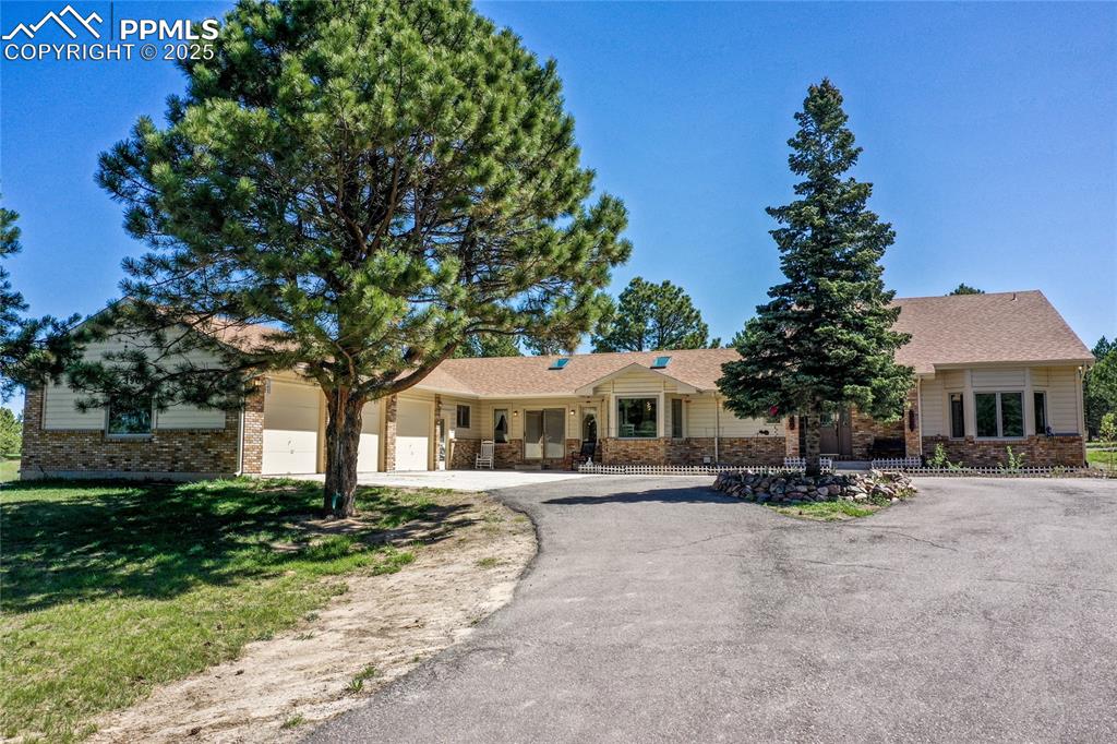 ALL NEW INTERIOR PAINT, CARPET, & CABINETRY HARDWARE! *AC & FURNACE 2024*WATER HEATER 2020*ROOF & SKYLIGHTS 2017*Come see this 4/4 home in the highly sough-after Arrowhead III; a firewise community with a chipping program and neighborhood watch. You'll fall in love with the house, but what will seal the deal is the 3-car oversized 900+ square foot attached garage, complete w/workbench, cabinetry, a large window, & 2 doors for easy access from the front of the garage or to the rear of the property. This nearly 2.4-acre parcel is breathtaking and combines the perfect mix of meadows and trees providing for privacy, peace and tranquility. If you are a golfer, you'll appreciate the proximity to Kings Deer Golf Club. Gorgeous hardwood floors have just been newly refinished. Carpets have just been shampooed.  Kitchen is complete with gas cooktop, pantry, & a built-in desk for easy organization of mail and paperwork. The primary bedroom will likely become your sanctuary with more than enough room for a sitting area/reading nook while you look out the bay window onto your beautiful landscape.  And you just might get lost in the attached primary bathroom complete with newly tiled HEATED floors!  And also a newly tiled shower and jacuzzi bath surround along with it's very own walk-out to the serenity of the backyard.  Off the living room, enjoy another walk-out to the massive 12x27 concrete patio complete with electric awning. Last, but certainly not least, you'll find endless options for the bedroom with attached bath that is located on the opposite end of the home from the other bedrooms; complete with built-ins, wet bar and its very own walkout to the backyard.  Just some of the options for this space could include a mother-in-law suite, game room, exercise room, or an office large enough for two!  Don't miss this tranquil property. Come see it today!