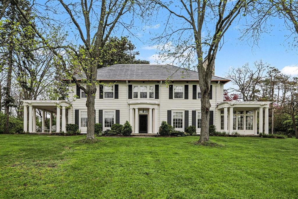 It is a rare privilege to present one of Ann Arbor's most distinguished and architecturally significant residences: the Arnold and Gertrude Goss House, proudly listed on the National Register of Historic Places. Set on more than five private acres in the heart of Ann Arbor, this stately custom-built estate was designed by renowned architect George DeWitt Mason, with the grounds masterfully planned by Aubrey Tealdi, former Director of the Nichols Arboretum. The result is a breathtaking setting featuring lush mature trees, rolling lawns, and exceptional privacy.  The home's interior reflects the highest standards of early 20th-century design, materials, and craftsmanship, standing today as one of the region's finest preserved examples of the era. Highlights include beautiful hardwood floors, a grand entrance hall with sweeping staircase, an oversized formal living room with fireplace,an elegant library with built-in bookcases, and an exquisite formal dining room with fireplace.The updated kitchen offers white cabinetry, a Sub-Zero refrigerator, generous workspace, and abundant natural light. An incredible sunroom with fireplace and walls of windows provides stunning views of the surrounding grounds.The upper level features five bedrooms and three full baths. Two bedrooms have been thoughtfully combined to create an expansive primary suite with an attached bath and built-in closet storage.  Additional bedrooms are spacious and filled with natural light.  The finished lower level includes a large recreation room and ample storage, while the walk-up attic offers even more flexible storage space. The home has been meticulously maintained, with updated electrical systems and a new boiler.  A truly exceptional and historic offering in a premier location.  Home Energy Score of 1. Download report at a2gov.org/herdmap
