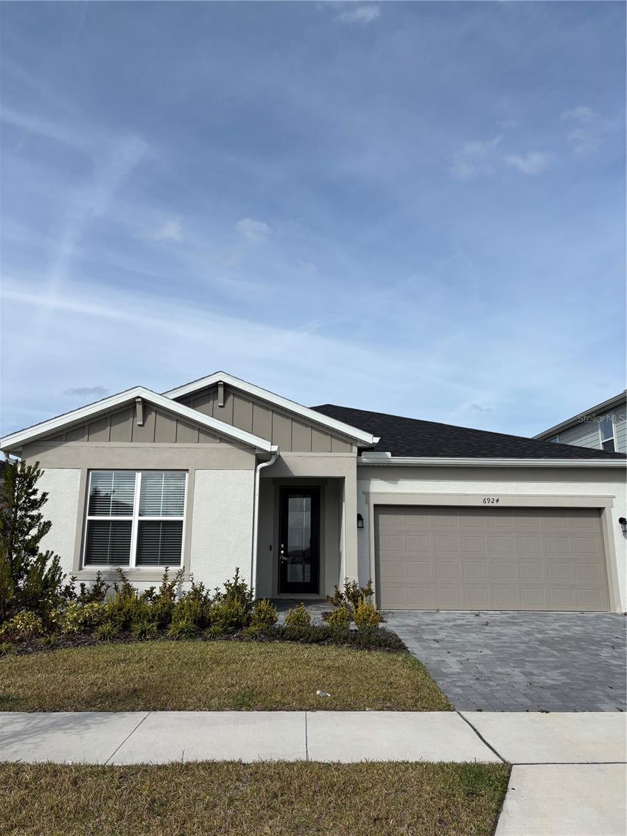 Under Construction. EverBe is a new master planned community where convenience and connections combine to create a new standard for home. Located in Orlando with quick access to 417 & 528, this lifestyle community will offer miles of pathways & trails, wi-fi-enabled green spaces, unique outdoor recreation areas, a fitness center, a clubhouse complex with resort pool, 2G internet, and a waterfront amenity and town center. Get excited for EverBe - everything home should ever be!Step into the Garnet by Pulte, a single-story home offering 4 spacious bedrooms and 2 beautifully appointed bathrooms. The open-concept layout seamlessly connects the kitchen, café, and gathering room, creating an airy atmosphere. The heart of the home is the chef-inspired kitchen, where white cabinetry meets luxurious quartz countertops. The kitchen boasts a large center island, a convenient storage pantry, and top-of-the-line Whirlpool stainless steel appliances—including a built-in cook top and refrigerator. From the kitchen, the Garnet flows effortlessly into the café and gathering room, leading to a covered lanai, making this home ideal for seamless indoor-outdoor living. Retreat to the luxurious owner’s suite, a serene sanctuary with a spacious walk-in closet and an en suite bathroom. Dual vanity sinks, a frameless glass-enclosed shower, and a linen closet complete the tranquil space. The three additional spare bedrooms and bathroom provide ample space for family and guests. Every detail of this home has been carefully curated, from the wood-look luxury vinyl plank flooring throughout the main living areas, to the plush, stain-resistant Shaw carpeting in the bedrooms and the beautiful tile in the bathrooms and laundry room. Designer-curated finishes elevate every corner of this home, including brushed nickel hardware and plumbing fixtures, 2” faux wood blinds, and Sherwin Williams Drift of Mist Interior Wall Paint throughout. Enjoy the convenience of modern living with a smart thermostat, video doorbell, and LED downlighting. Schedule a tour today!