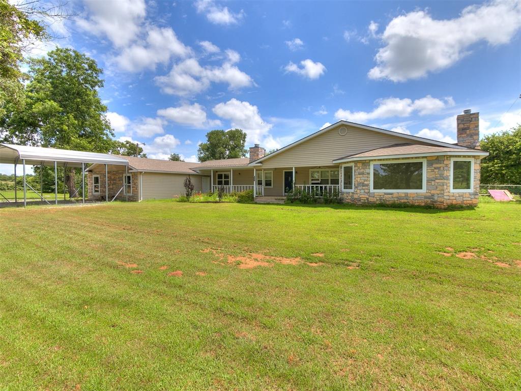 Exceptional 5-Bedroom, 3-Bath Estate on 7.5 Acres with Shops, Pool, and Generac Backup Power! This spacious, well-appointed home offers the ideal layout for large or multi-generational families, with a desirable split floor plan, two separate living areas, and countless upgrades throughout including neutral paint and new carpet. The expansive great room features soaring 12-foot ceilings, a stunning rock fireplace, built-ins, surround sound, bay windows, and French doors. The primary suite provides true retreat-style living with a jetted tub, separate shower, walk-in closets, and abundant space. There are two additional rooms that could be used as a bedroom, study, or hobby room that are not counted in the 5 bedrooms listed. The kitchen is equipped with KitchenAid stainless steel appliances, a dual fuel cooktop (gas & electric), granite countertops, and extensive storage. A large laundry and pantry area features built-ins, folding tables, hampers, and ample cabinetry. Enjoy year-round peace of mind with a Generac natural gas generator with automatic transfer switch, plus two 4-ton HVAC systems and three hot water tanks. The home also boasts a 4-year-old heavy-comp roof, large covered porches front and back, and an oversized attached two-car garage with an above-ground storm shelter for added safety. Outside, this property truly shines with a 30’ x 40’ metal shop wired with 240-volt power, a 24’ x 30’ metal shop with 120-volt power, an RV carport, an additional carport, and a 30-foot round, 54-inch-deep pool with a one-year-old liner and deck—perfect for entertaining. All situated on 7.5 picturesque acres, offering privacy and space while being conveniently located near Lake Thunderbird for recreation and outdoor fun.