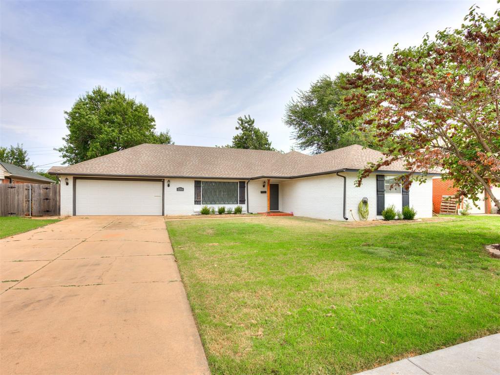 Welcome to this inviting 3-bedroom, 2-bathroom home offering 1,662 sq. ft. of comfortable living space in a prime Oklahoma City location. From the moment you arrive, you’ll love the curb appeal—white brick exterior accented with black shutters and trim creates a clean, timeless look. Step inside to find two spacious living areas, giving you flexibility for a second sitting room, playroom, or home office. The cozy galley kitchen is equipped with a stainless steel dishwasher and is designed for efficiency, while the dining area flows seamlessly into the living spaces. Throughout the home, you’ll find built-in shelving and cabinetry that provide both charm and functionality. The primary suite offers a comfortable retreat with its own full bath, while the additional bedrooms are well-sized and share a second full bathroom. A 2-car garage provides secure parking and extra storage. Out back, enjoy the covered patio overlooking a large, tree-filled yard—perfect for entertaining, relaxing evenings, or weekend barbecues. The mature trees offer both shade and privacy, creating a space you’ll enjoy year-round. With its thoughtful layout, charming details, and a few updates already in place, this home is ready for new owners to make it their own. Don’t miss the chance to see it in person—schedule your showing today!