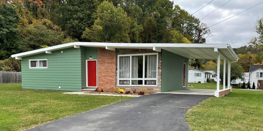 Here it is, your opportunity to own this Mid-Century Modern move-in ready home located one block away from the Damascus Town Park! This property was not impacted by Hurricane Helene. Hop on the Virginia Creeper Trail, just at the end of the street and across the road. The Town Park is only a block away. The current owner has made numerous upgrades over the last few years, including a new metal roof, a new heat pump, new kitchen countertop, new interior and exterior paint, 200 amp panel box, upgraded plumbing, new washer/dryer hookups, and a completely remodeled and enlarged bathroom designed with accessibility in mind. The doorway to the bathroom and one bedroom have been widened. This house is close to being ADA compliant. HUGE .35 ac. lot with room for a second dwelling unit (Buyer's agent to confirm with Town).  This property can be used as an AirBnB, as confirmed with the Town on 11/7/25. Don't miss this opportunity! Owner/Agent. Note: Are you looking for a family compound situation? A property to live in and another to use as a vacation rental? Look no further, the house next door at 533 Docie St. is also for sale; different owner, same Agent. Inquire for details.