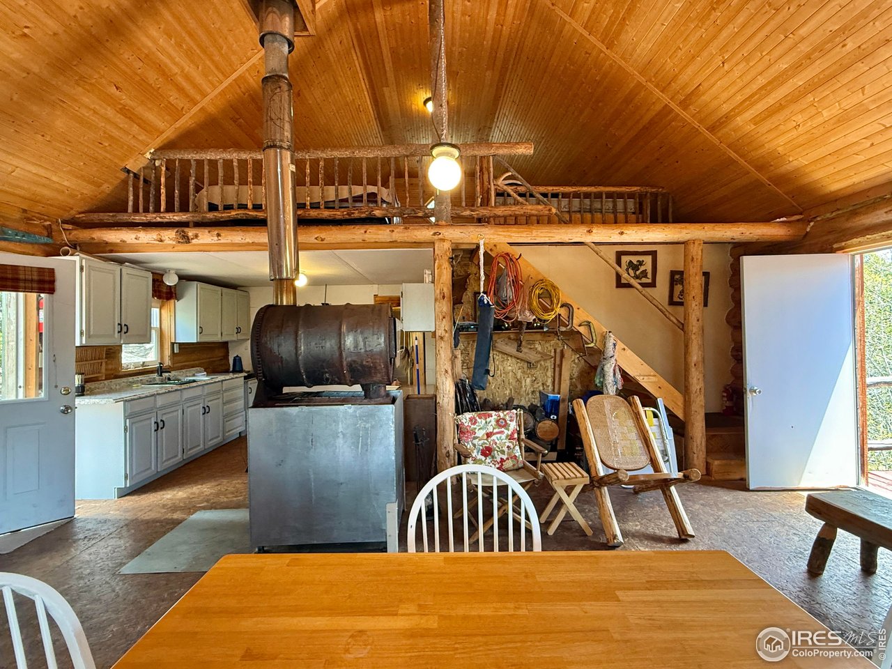 Log Cabin in Cedar Park with snow-capped mountain views. 5.47 acres of privacy. Surrounded by Roosevelt National Forest. Furnished one bedroom, one bath with a loft for extra sleeping area. Kitchen has a propane cook stove and a propane refrigerator. Vaulted ceiling in the great-room. Wood-burning stove, solar for lights. 50 gl Cistern filled by rainwater collection system, and a composting toilet in the bathroom. Wraparound deck on three sides. Plenty of room to roam with National Forest Access. Short 1.7-mile walk to The Monastery climbing area. Inclusions: all furniture and tools. Cash or portfolio bank loans. Will not go with Conventional financing!