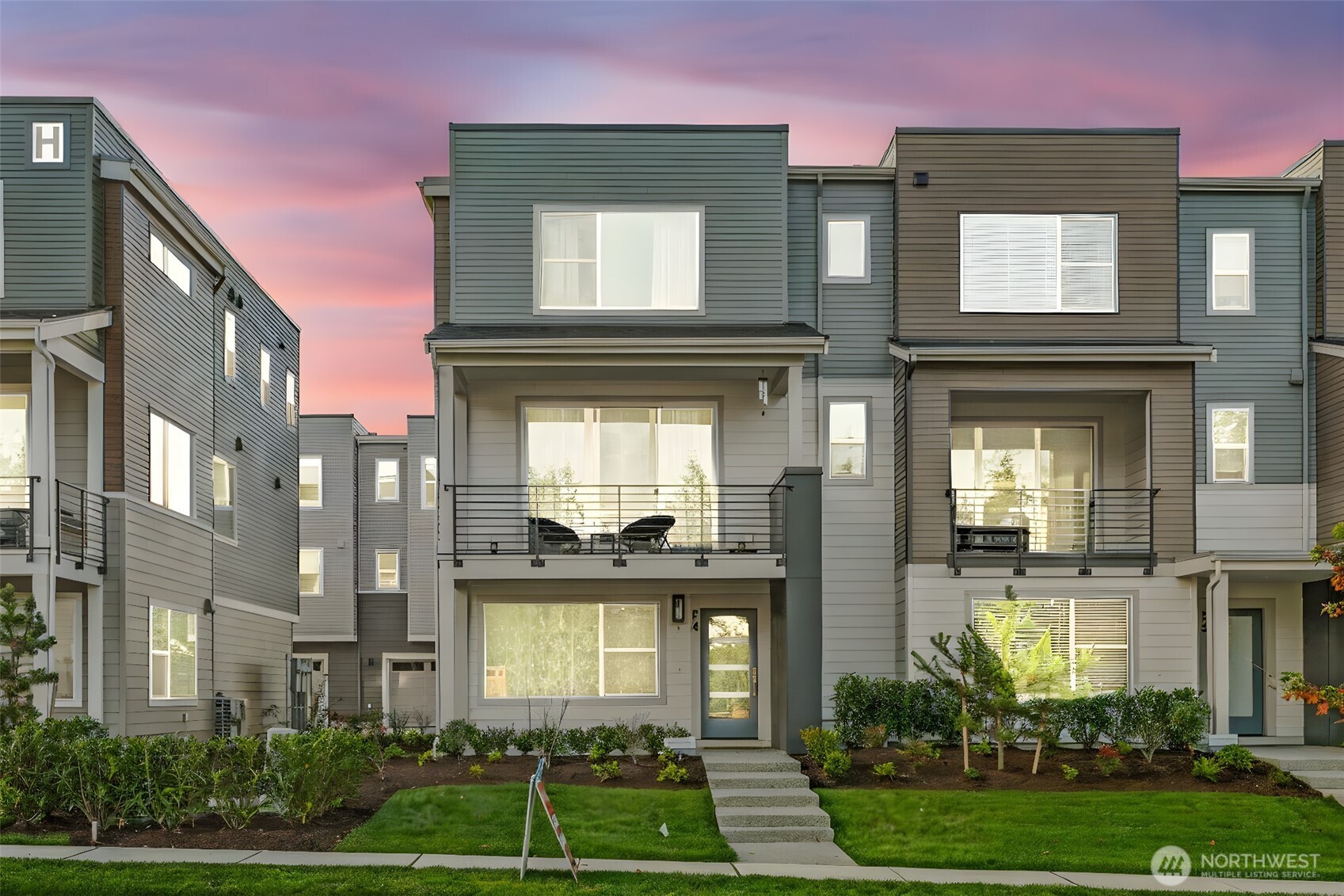 East-facing, park-front MainVue home at Elmbrook – The Spruce floorplan.    This beautifully designed end-unit offers modern elegance across three levels, featuring an extended covered porch with direct park views, a welcoming foyer, and a private guest suite on the entry level.    The main level is designed for both comfort and style, with a chef’s kitchen showcasing Quartz countertops, sleek European cabinetry, premium KitchenAid appliances, a walk-in pantry, and a dedicated study nook. A covered deck extends your living space outdoors with serene park-facing views.    Upstairs, retreat to a luxurious primary suite complete with a walk-in closet and a spa-inspired bath with dual Quartz vanities. Enhanced with air conditioning on every level, ensuring comfort throughout the home during warmer months.    Ideally situated across from Fernwood Elementary and just minutes from North Creek High School — a rare blend of location, design, and lifestyle.