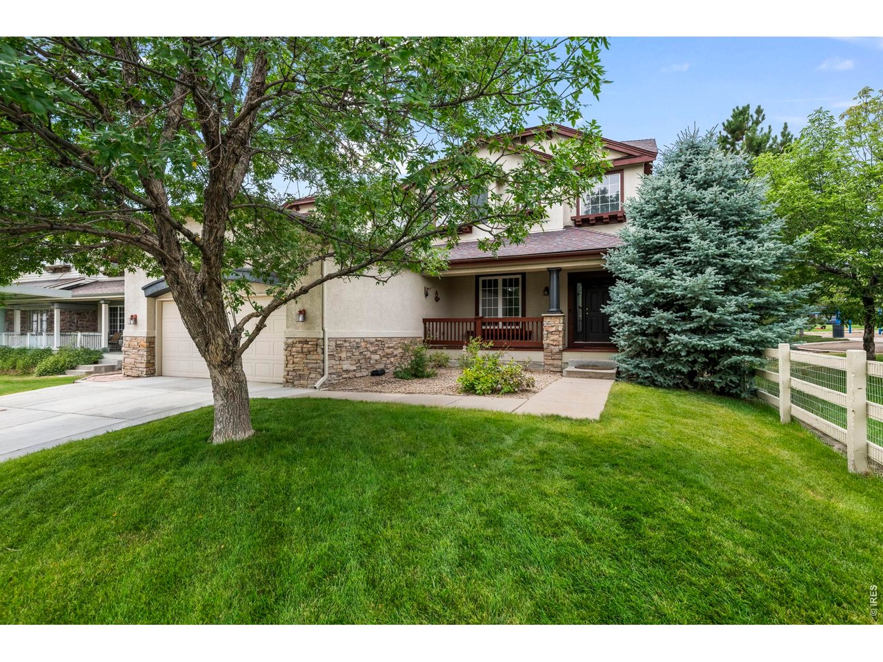 Beautifully updated and perfectly situated on a quiet street next to a park! This spacious home welcomes you with a dramatic two-story entry, soaring ceilings and tons of windows filling the home with natural light. Brand-new interior paint, brand-new carpet, updated light fixtures and wood floors on the main level create a fresh, move-in-ready feel. The light-filled two-story sitting room features a dual-sided gas fireplace adjoining the cozy great room with gas fireplace. The main level flows in to the large open kitchen with abundant cabinetry, tile backsplash, gas cooktop and stainless steel appliances. Seller is willing to offer a credit toward updating the kitchen countertops-an opportunity to personalize the space to your style!Enjoy the gorgeous, park-like backyard with mature trees and landscaping offering wonderful privacy. A large stamped concrete patio and covered outdoor area are perfect for summer evenings and entertaining, with the park right next door adding to the peaceful setting.Upstairs, a large loft provides flexible office or living space. The spacious primary suite features a gas fireplace and five-piece bath with soaking tub, while two additional bedrooms share a Jack-and-Jill bath. The fully finished basement offers a media area, wet bar with mini fridge, spacious fourth bedroom with private 3/4 bath, plus two additional flex spaces- ideal for a gym or office. An exceptional combination of natural light, flexible living spaces, mature landscaping and a fantastic location! Schedule your private showing today!
