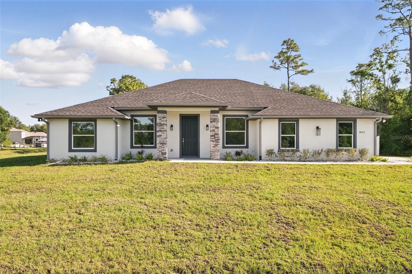 ***Up to $10,000 Lender Credit for buyer’s closing costs if using our preferred lender!***

***Brand-New Custom Home on 1 Acre with MIL Suite & Designer Finishes.***

Discover the perfect blend of luxury, functionality, and space in this 4-bedroom, 3-bath custom home, thoughtfully designed for modern living and entertaining. Set on a full acre in a vibrant, golf-cart-friendly community, this home offers room to live, work, and relax in comfort.

Step inside to find an open-concept layout featuring a formal dining room, private office, and a spacious living area that seamlessly connects to the kitchen.   Step through the 8-foot, 3-panel sliding glass door to the oversized covered lanai-perfect for indoor-outdoor living.

The chef’s kitchen is a showstopper, with stainless steel appliances, a large island with deep sink, slide-in range, and an airy breakfast nook overlooking the backyard.

Retreat to the luxurious primary suite, complete with tray ceiling, private lanai access, an 11-foot walk-in closet, and a spa-style bath featuring a large walk-in shower with rain showerhead & bench, dual vanity, linen closet, and private water closet.

Need flexible space? The MIL suite offers a private entrance, full bath, sitting area with kitchenette, and a bedroom with dual closets-ideal for extended family, guests, teens, or even a private client-facing office.  Multi-Generational Living at the BEST price around!

Additional highlights:

Large lanai spanning the rear of the home

Gutters and partial fencing already in place

Split-bedroom layout with Jack-and-Jill bath between secondary bedrooms

1-acre lot with room to add a pool, garden, or workshop

Side-load garage and ample parking

All nestled in a community with a nature preserve, A-rated Pre-K–8 school, dog parks, sports courts, and playgrounds—just 30 minutes to beaches, theme parks, and downtown Orlando, and 20 minutes to MCO.

This is the lifestyle upgrade you've been waiting for. Schedule your private tour today!