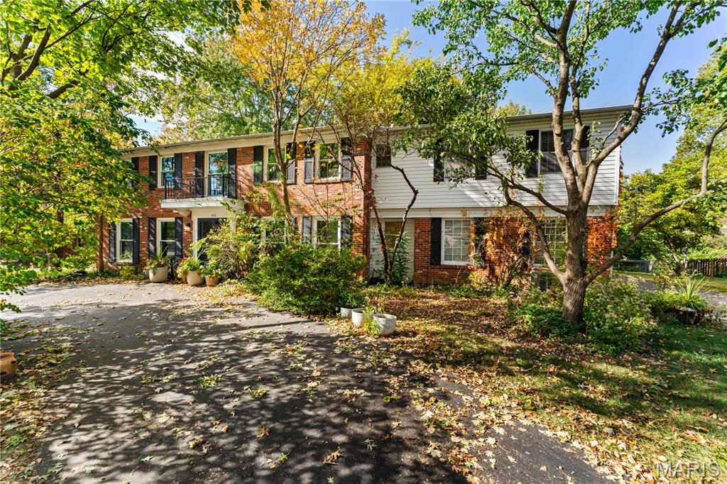 SWEAT EQUITY OPPORTUNITY IN LADUE SCHOOLS!Bring your vision and finishing touches to this spacious, livable home situated on nearly half an acre in the sought-after Ladue School District. Offering over 4,200 square feet of living space, this property presents an incredible opportunity to create your dream home.The main level features a generous living room, a family room with fireplace, an eat-in kitchen, a formal dining room, a convenient half bath, and main-floor laundry. Upstairs, you'll find six spacious bedrooms and three full bathrooms, including a primary suite with a walk-in closet and an additional sitting area—perfect for a home office or sitting room.The finished walk-out basement offers even more living space, complete with a full bathroom and direct access to the level backyard. Ample parking is another bonus, with a two-car garage and circular driveway.With generous space, a desirable location, and endless potential, this is your chance to transform a well-loved home into something truly special. Don't miss this exciting opportunity!