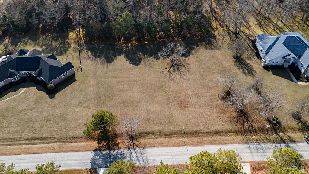 This attractive homesite is situated in the highly desirable community of Butlers Bluff. The lot spans 1.5 acres and features over 200 feet of frontage along Butlers Bluff Drive. It is open and level, ready for construction, with a partially wooded area at the back. The property is surrounded by established homes with full-time residents, creating a beautiful and convenient community.  Kiptopeke State Park is just a short bike ride away, offering a sandy beach, fishing pier, boat launch, and walking trails. Furthermore, Virginia Beach is only 30 minutes away, making this an exceptional opportunity at a reasonable price. Historic Cape Charles is just 15 minutes to the north, a charming town filled with shops, galleries, restaurants, and the historic Palace Theatre.