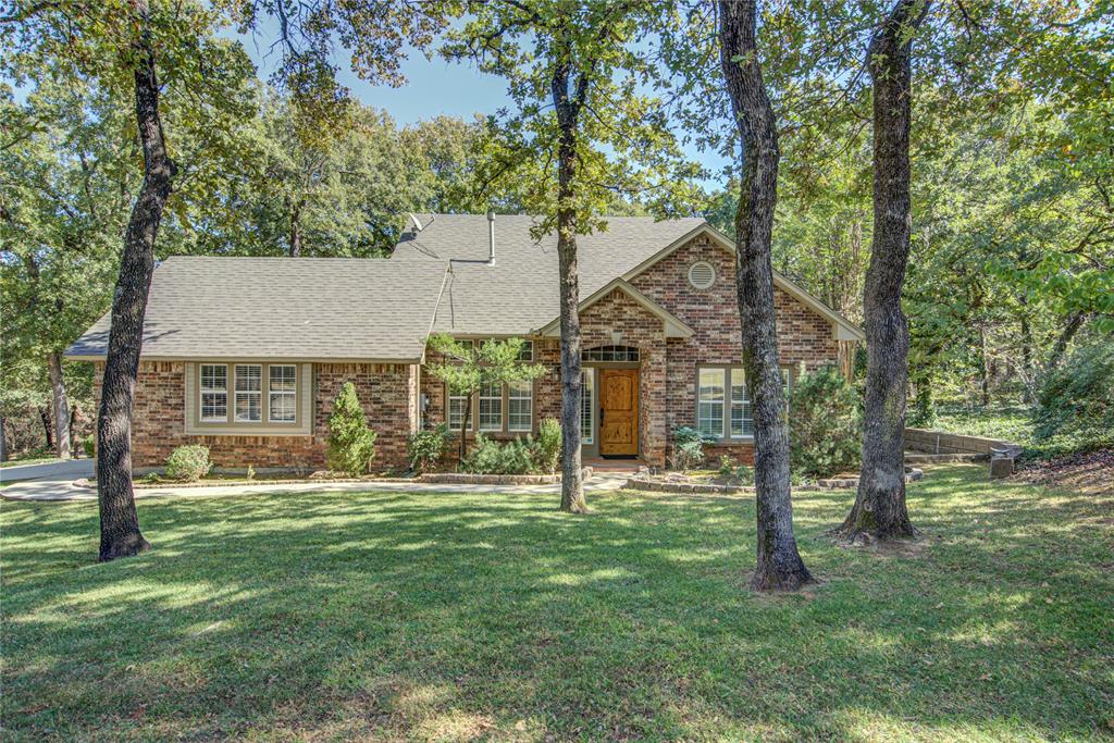 Discover your perfect retreat on two sprawling acres where mature trees create a natural canopy over this charming three-bedroom, two-bathroom home. With 1,809 square feet of thoughtfully designed living space, wood floors flow seamlessly throughout, adding warmth and character to every room. The heart of the home features updated appliances and a convenient breakfast bar, perfect for casual dining and entertaining guests. Whether you choose to use the additional space as a formal dining room or second living area, the flexible floor plan adapts to your lifestyle needs.
Step outside to your personal oasis featuring a wood deck and covered patio with stunning wood ceiling details. Landscape lighting illuminates the property beautifully in the evenings, while the sprinkler system keeps your grounds looking pristine year-round. The included storage shed provides practical space for tools and seasonal items. Inside, elegant shutters frame the windows, and a wood-burning fireplace creates the perfect focal point. The combination of indoor and outdoor living spaces makes this property ideal for both quiet relaxation and lively entertaining. This property represents an exceptional opportunity to own a piece of Oklahoma's natural beauty while enjoying modern conveniences and thoughtful updates throughout.