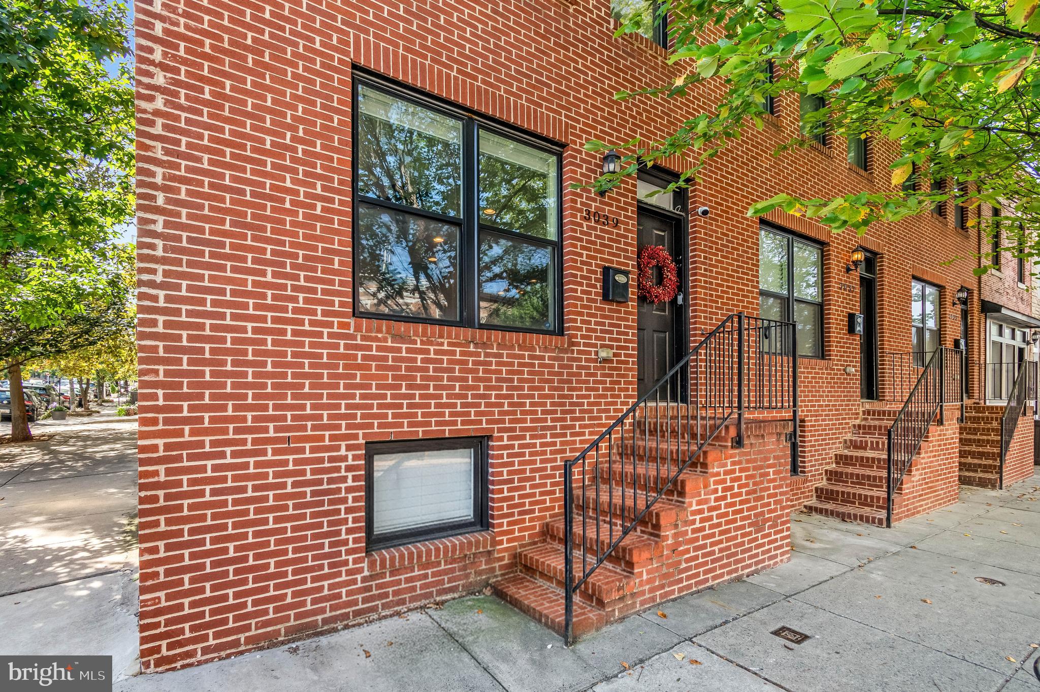 Welcome to Patterson Park! Step into 3039 E Baltimore St — a show-stopping 5-bed, 3-bath end-of-group townhome offering over 2,500 sq. ft. of open-concept living. Natural light pours through every window, highlighting the gorgeous hardwood floors and the spacious kitchen with a breakfast bar and generous countertop space. The finished lower level features remarkably high ceilings, providing an ideal space for guests, a home gym, or a creative workspace. The attached garage offers extra-tall ceiling clearance, perfect for oversized vehicles and additional storage — a rare advantage in the city. Entertain like never before with your whole-home audio system and on your private rooftop deck with panoramic city views — perfect for sunsets, gatherings, or relaxing under the stars. All of this in an unbeatable location just steps from the iconic Patterson Park and vibrant nightlife. Minutes to Johns Hopkins and Bayview Hospitals, this home has the space, style, and energy you’ve been waiting for.