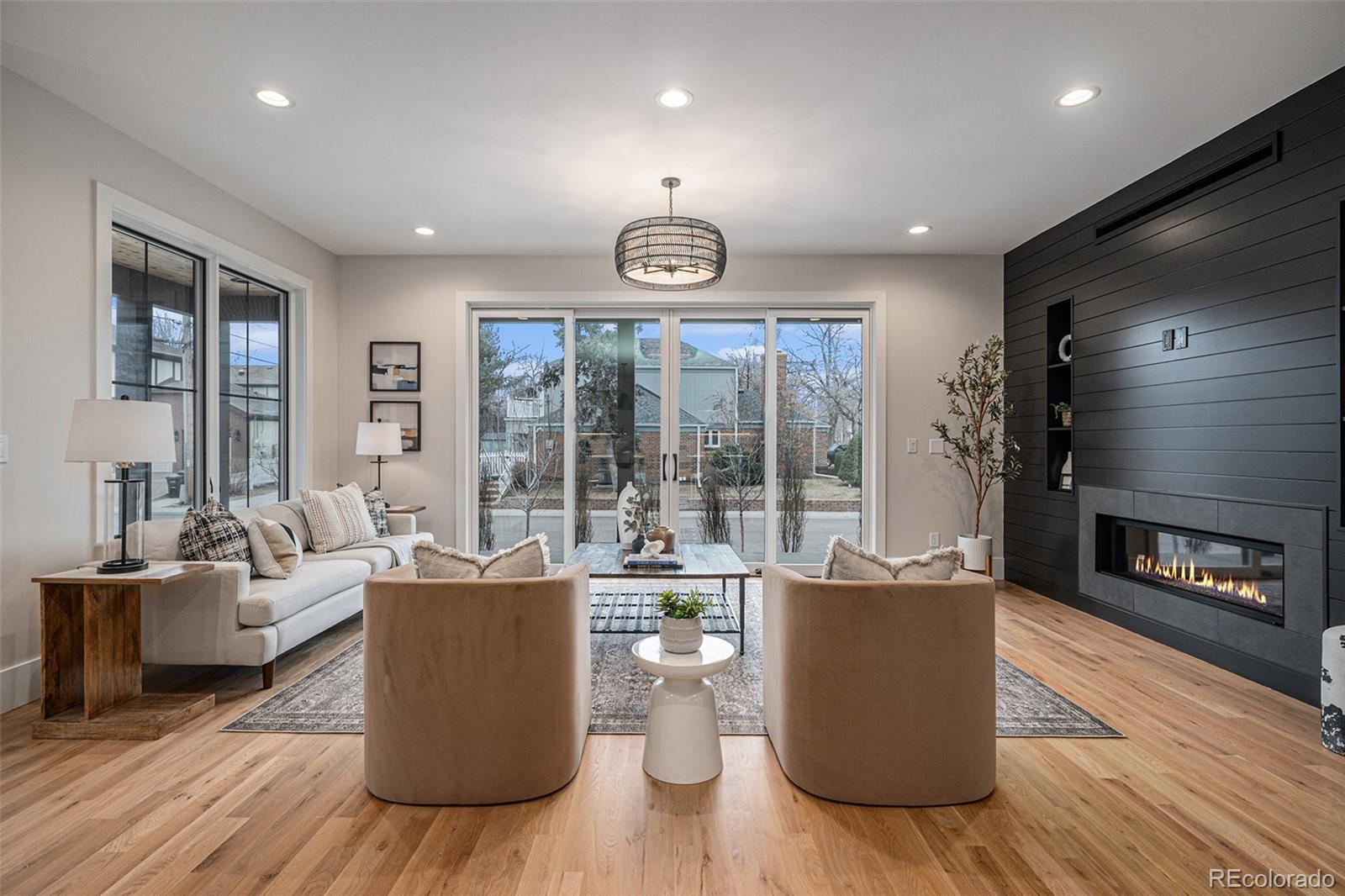 New construction in Denver's desirable Mayfair neighborhood. This 5-bedroom, 5-bath luxury home by H3 Builders sits ona prominent corner lot and features an attached garage, private backyard, and functional mudroom. The sun-filled mainlevel offers high ceilings, an open-concept layout, and custom finishes throughout. The gourmet kitchen includes high-endappliances, a large island, and walk-in pantry, opening seamlessly to the living and dining areas. A private home office andpowder bath complete the main floor. Upstairs, the spacious primary suite features a spa-like bath and walk-in closet,along with two additional en-suite bedrooms and an upper-level laundry room. The finished basement boasts 9' ceilings, alarge rec room, flex space ideal for a gym or office, an additional bedroom, and full bath. Conveniently located near 9th &Colorado, Cherry Creek, parks, dining, and Carson Elementary. Rare opportunity for new construction in one of Denver'smost established neighborhoods.