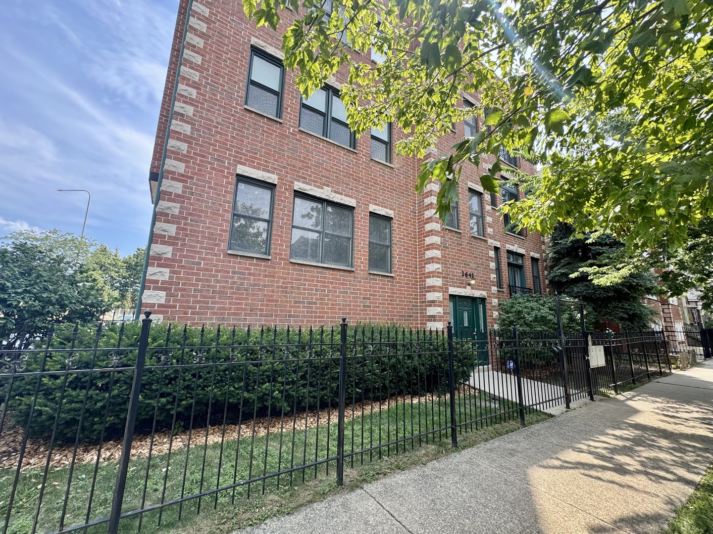 Enjoy city living in the heart of Logan Square, only 1 block from Logan Boulevard! This corner unit 2 Bed | 2 Bath is surrounded with windows (all windows replaced 2022) and sunlight. The spacious living room has additional space for office, a wood burning fireplace,   And separated dining area that is open to kitchen, . All stainless steel appliances with granite counters and backsplash. The balcony is accessed off the dining area convenient for grilling. Main bedroom has a walk-in closet, additional storage, and en-suite bathroom. Unit features in-ceiling surround sound, ceiling fans, hardwood floors throughout, and central air conditioning. In unit W/D.   Attached garage parking is included (garage door mew in 2020), with direct access from bldg.   Favorite eats in the area Mi Tocaya, Akahoshi Ramen,   Girasole Tratorria, and Pretty Cool for dessert! Close to Logan Square nightlife at Fullerton/Milwaukee and Logan/Milwaukee.  Short drive to Target, Costco, Home Depot. Easy Access to 90/94 and near Logan Sq. and California Blue Line stops.