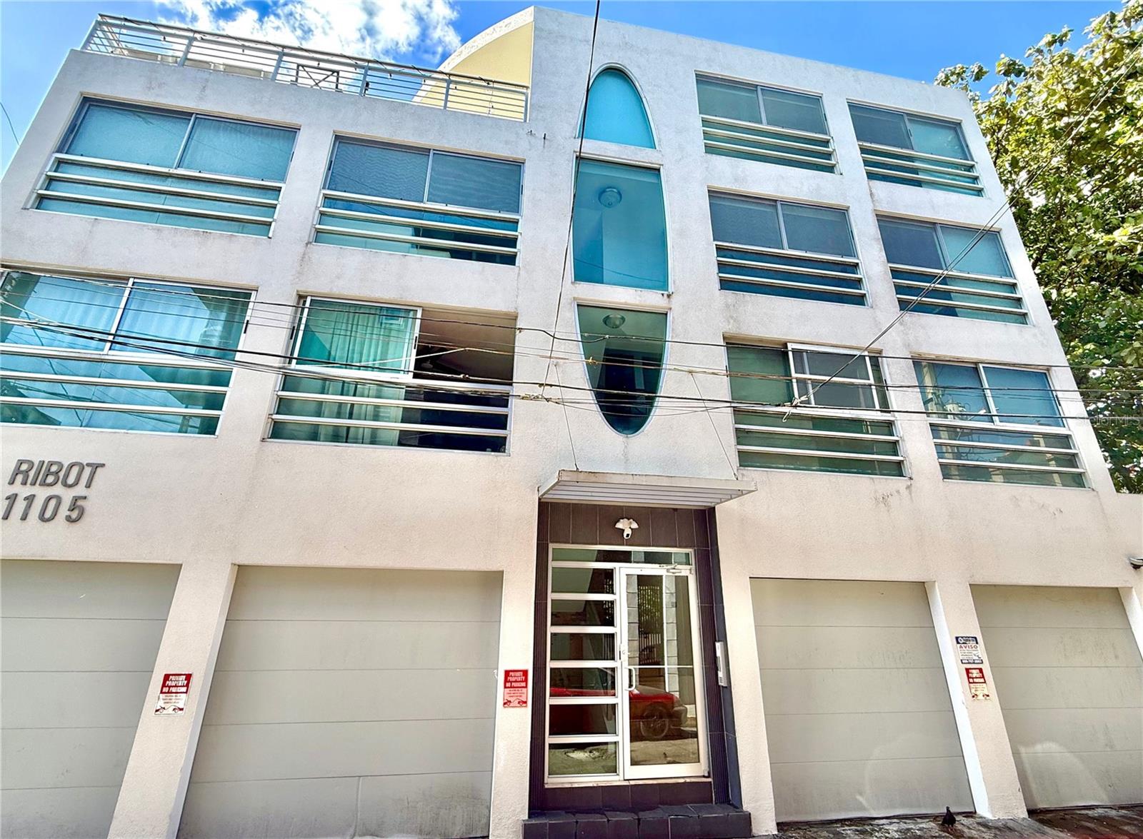 Discover a rare opportunity to own a fully furnished, income-producing duplex residence in the vibrant cultural heart of Santurce. Located at Ribot Street #1105, this unique offering combines a stunning 2,110 sq.ft. modern penthouse with an adjoining 665 sq.ft. residence—creating an expansive and versatile 5-bedroom, 4-bathroom urban compound unlike anything else currently on the market.Perfectly positioned between Miramar’s renowned dining and entertainment scene—including Distrito T-Mobile, Centro de Bellas Artes, and La Placita—and the upscale lifestyle of Condado’s beaches, nightlife, boutique shopping, and restaurants, this property offers unmatched access to the very best of San Juan. Just minutes from Hato Rey’s financial district, Old San Juan, and Luis Muñoz Marín International Airport, the location is ideal for professionals, investors, and lifestyle buyers alike.The primary penthouse residence spans two levels and showcases contemporary design with soaring ceilings, abundant natural light, and a seamless open layout. The first level features spacious living and dining areas, a modern kitchen, laundry, guest bedroom, and full bath. Upstairs, a comfortable family room connects to two ensuite bedrooms, including a generous primary suite. Crowning the home is an expansive, wrap-around rooftop terrace—beautifully furnished and ideal for entertaining, al fresco dining, or relaxing with open-sky city views.The adjoining second residence on the same main floor, a fully renovated 2-bedroom, 1-bath unit, mirrors the same modern aesthetic with an efficient open layout, high ceilings, and abundant natural light—perfect as a private guest suite, in-law quarters, or turnkey rental.Both residences are fully furnished and thoughtfully equipped for comfort and continuity, featuring high-speed Wi-Fi, a backup generator, and water cistern system. The property includes 3 covered parking spaces in total.Set within a boutique building offering only two units per floor, residents enjoy a private, secure environment with a clean, modern design—an urban retreat just steps from Santurce’s most dynamic attractions.This dual-unit offering presents exceptional flexibility: live in one residence while generating rental income from the other, accommodate extended family with privacy, or maximize returns with a high-demand dual-income investment property. Few opportunities in Santurce deliver this level of scale, versatility, and lifestyle appeal in one seamless acquisition. A truly distinctive property tailored for discerning buyers seeking both lifestyle and investment value.Combined HOA: $313/mth., Property taxes $2,661.82/yr., Insurance: $3,675/yr. Tax incentives may apply.Private showings available by appointment.