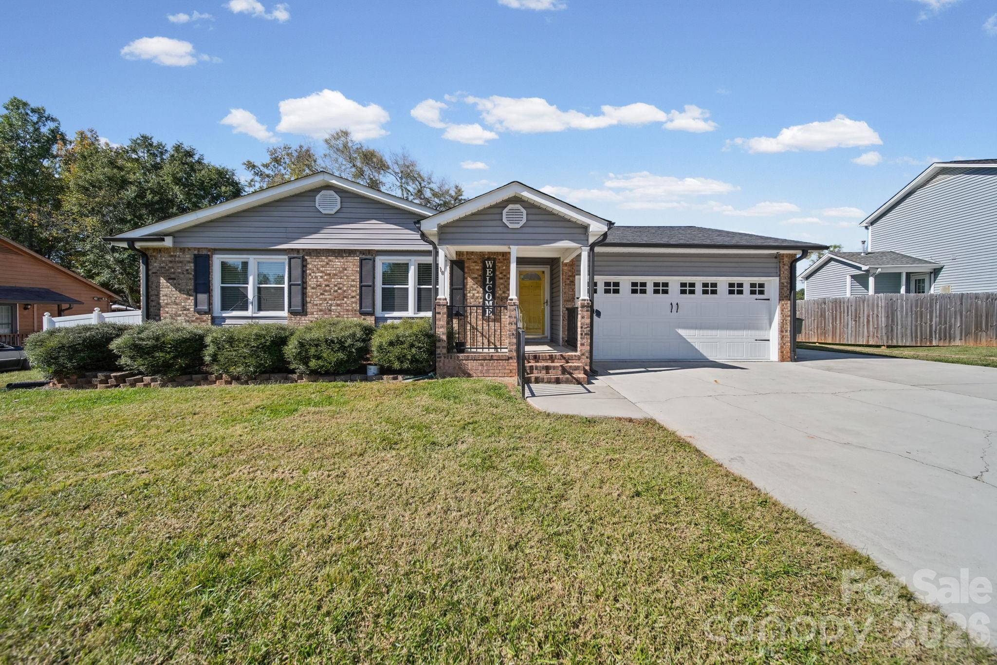 Welcome home to this 3-bedroom, 2-bath brick ranch featuring an open floor plan and inviting living spaces! The great room offers vaulted ceilings, skylights that fill the space with natural light, and a fireplace, creating a comfortable place to relax or entertain. The primary bathroom was updated in 2021 with a walk-in shower, and the second bathroom was also updated in 2021 with a tub/shower combination. Enjoy beautiful sunsets over Crowders Mountain from the huge deck, perfect for outdoor gatherings or relaxing at the end of the day. The fenced backyard features an above-ground pool and a nice-sized outbuilding for extra storage or workspace. Additional highlights include a finished garage, a tankless water heater installed in 2022, and a location in an established neighborhood. This home offers comfortable living, outdoor enjoyment, and practical updates!
