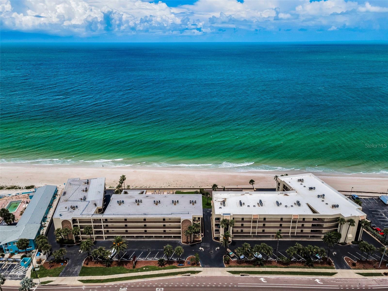 BEACHSIDE BLISS meets Boutique living in the Intimate Condo Community of Montmartre! Think of sunrise coffee on your private balcony, toes-in-the-sand afternoons, and warm evening breezes scented with salt air and serenity. Montmartre Condos on Belleair Beach, INDULGE in the privacy of a Mid-rise, Low-Density Coastal Sanctuary—only 54 sophisticated units across four (4) levels! Rarely available 1 bedroom, 1 bath beachfront residence with ENDLESS waterfront views and beautiful sunsets on a pristine, white sandy beach is truly a rare find! The Belleair Beach area, known for its uncrowded & expansive coastline as well as the ICONIC beachfront setting, is an address that speaks for itself! Perfect for those seeking luxury, comfort, and the ULTIMATE seaside lifestyle. This sensational, FULLY FURNISHED residence featuring modern finishes and a serene, curated hue offers timeless beachfront living with thoughtful refinement. Enjoy Tangerine sunsets daily from your private Gulf front balcony! Take in the views of the pearlescent beaches and azure waters of the Gulf! This striking condominium is being sold FULLY FURNISHED and has been reimagined throughout to include recent refinements such as a sliding glass door restoration, newer appliances, wood colored laminate flooring, California closet system in the primary bedroom, freshly painted interior (2020), newer HVAC (2018), Washer & Dryer (2020), and efficiently designed Kitchen with wood cabinets, granite counters and a breakfast bar that is a seamless extension of the culinary space bringing comfort and connection to the heart of the home! The entry has a private Alcove that elevates the sense of arrival and makes this residence unique. Step into the Living & Dining area where luxury meets tranquility. Soaked in sunlight, framed by the waterfront, this truly captures the essence of coastal living and enhances elegant entertainment. Adjacent to the living & dining area and off the entry is the tastefully updated Kitchen - perfect for the cook that doesn’t want to be separated from family and friends. The Beachfront Primary suite is cool & sophisticated with ample closet & storage space and will provide “suite retreat”. The sumptuous Primary bath is generous in size that has been tastefully restored. The unit comes with its own storage area at the same level, deeded under building parking space with additional storage closet & much more! This AMAZING boutique community features a large Community heated and cooled inground pool, FRESHLY REBUILT and expansive beachfront deck and gathering space, grilling areas, private beach access, separate Clubhouse, fitness room, common bike storage & more! The HOA amenities enhance comfort and convenience! Coastal living at its finest, the Montmartre Condo Community is a well maintained, beautifully landscaped condominium complex that offers Lifestyle, Luxury & Location! Embrace the beauty of seamless indoor-outdoor living in this exceptional, intimate Seaside retreat! Wake up to the sound of waves, enjoy direct, restricted beach access, and embrace SEASIDE SOPHISTICATION!