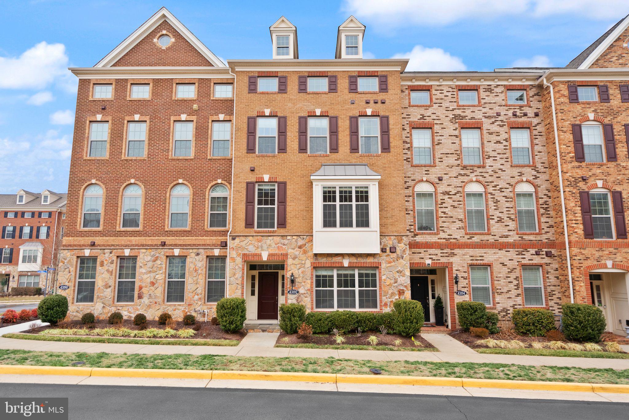 Welcome home to this stunning 4 level townhome in Ashburn!  This 2017 built home sits in the heart of Loudoun County and has everything you have been looking for.   Spanning an impressive 2900+ square feet, this home boasts 4 bedrooms, 3 full bathrooms, 2 half bathrooms, and is absolutely turn-key!  The open main level of this one is stunning and is centered around a beautiful white gourmet kitchen with a huge island, granite countertops with waterfall edges, and so much cabinet space.  You've also got a spacious main living area that is laid out perfectly for furniture, and the room is bathed in natural light off the back of the home where you'll find a nice composite deck!  You'll enjoy a dining space with plenty of room for a large table, plus a bonus space that could be used as an office nook, decoration space, or storage area!  All with 9 foot ceilings!  The third level is home to 3 spacious bedrooms and 2 full bathrooms, including a spacious primary suite with a great walk-in closet, and fantastic primary bathroom!  You'll enjoy a double vanity and an oversized shower with DOUBLE shower heads!  And can't forget to mention the laundry room on this level for ease of use!  The fourth level is home to a massive loft with a full wet bar, plenty of room for activities, a half bathroom, and an outdoor terrace as your second outdoor space.   The lower level features 4th bedroom and full bathroom that could easily be used as a guest space, or a large office space!  You've also got a spacious 2 car garage with a Tesla charger, and a 2 car driveway that makes this place the complete package!  The icing on the cake is the location - you're just minutes away from everything Loudoun County has to offer, including the Ashburn metro station, Brambleton Town Center, One Loudoun, Hal & Bernie Park, and you'll also have easy access to DC via the toll roads. This home truly is the full package, so be sure to come see it for yourself!