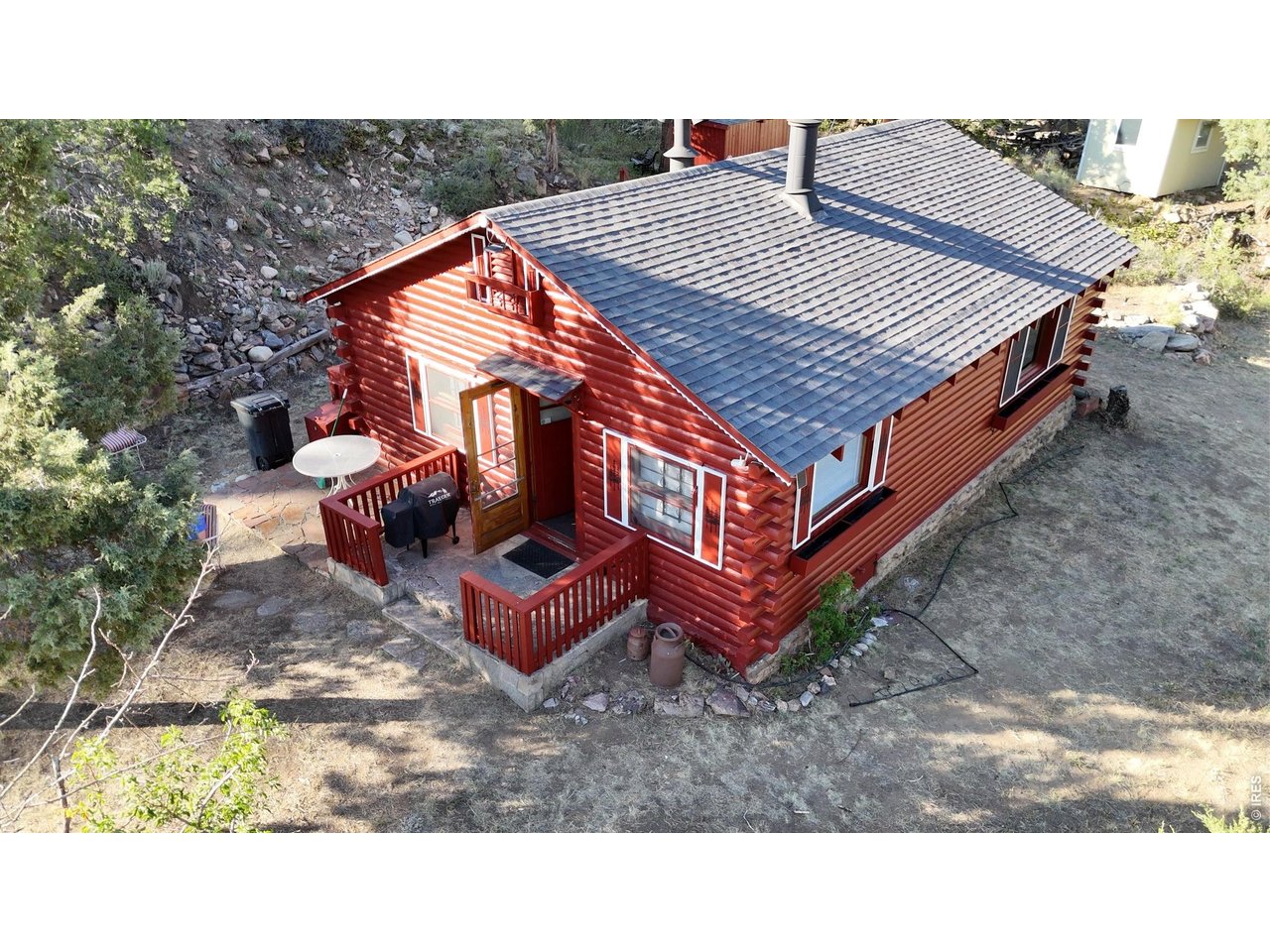 If you're looking for a turnkey mountain getaway in the beautiful Upper Cache La Poudre Canyon, this is it! Nestled on approximately one-third of an acre and bordered by National Forest on two sides, this charming property offers exceptional privacy, elevated river views, and a seasonal stream that adds to its peaceful mountain setting. The approximately 700-square-foot cabin features two bedrooms and one full bath and is being offered fully furnished. Features river views from the large picture window in the living room and from the kitchen windows too. Recent updates include new mattresses, a dual recliner-couch, recliner, a large-screen TV, and a dining table. The kitchen comes equipped with a double sink, refrigerator/freezer, cookware, a gas cooktop, woodburning stove, toaster, coffee maker, and everything you need to start enjoying the cabin immediately. The living room is centered around a classic wood-burning fireplace, with a full cord of seasoned firewood already stacked in the backyard and ready for use. Knotty pine walls, ceiling and hardwood floors create a warm, authentic Northern Colorado mountain atmosphere. A cozy loft provides a third sleeping area, making it ideal for kids and grandkids. The full bathroom includes a tub and shower combination, vanity, and sink. The property is served by a private well and a 1,500-gallon septic vault with an easily accessible clean-out. Outside, you'll also find a traditional outhouse with a concrete vault, an adjacent tool shed for additional storage, and abundant outdoor space to relax and enjoy the sights and sounds of the river. Conveniently located just one-half mile from Glen Echo and one mile from Archers, you'll have quick access to convenience stores, restaurants, a bar, and fuel while still enjoying the tranquility and recreation that make the Upper Poudre Canyon such a sought-after destination. Perfect for a weekend escape, a summer retreat, or a basecamp for hiking, fishing, hunting!