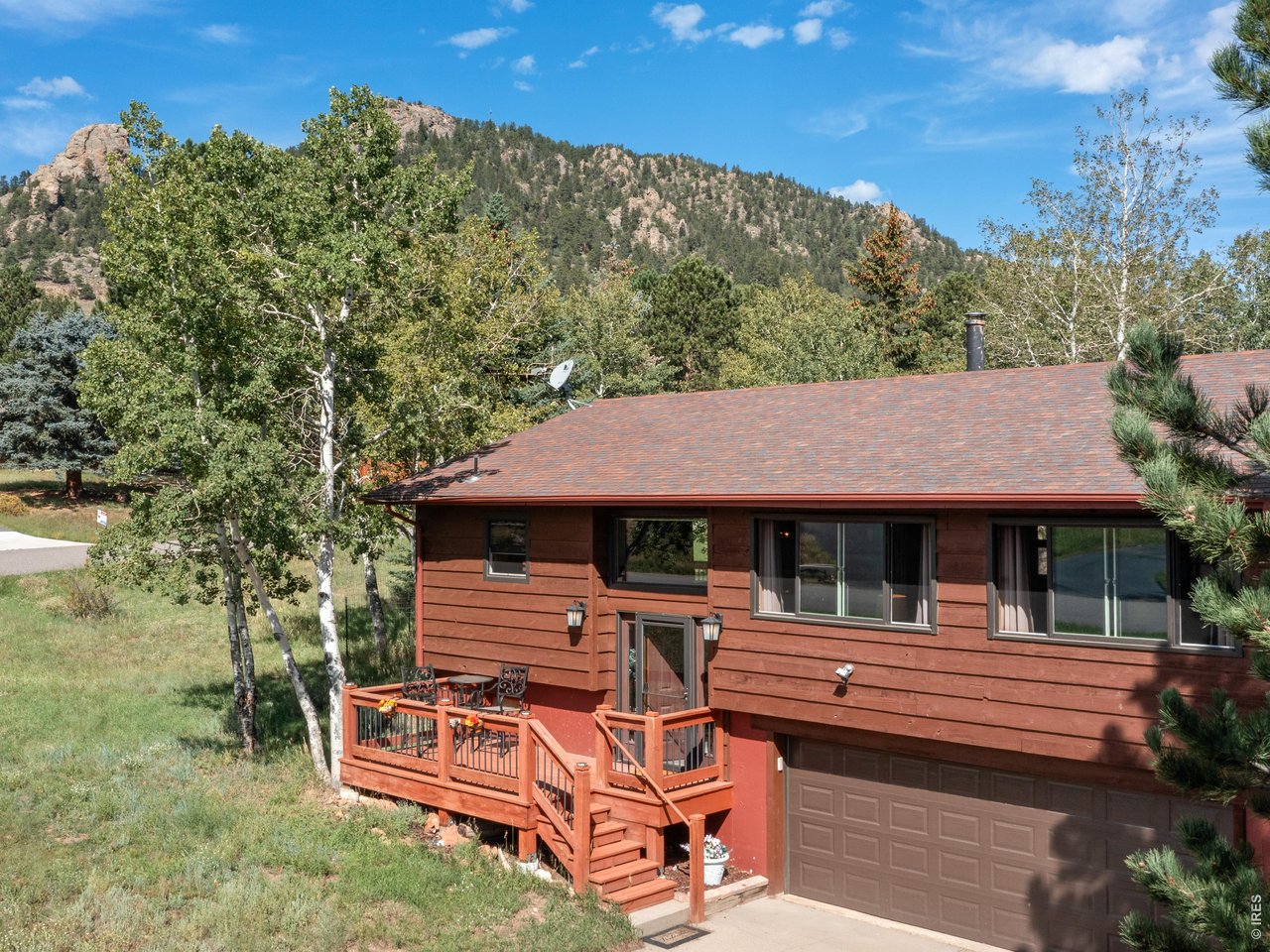 Move-in-ready 3-bedroom home in the desirable and peaceful Tranquil Vail subdivision. Thoughtfully updated throughout, this bright and inviting home features fresh look, and beautiful wood flooring in the kitchen and dining areas. The comfortable living room includes a large, efficient new gas fireplace/stove for chilly nights, while the spacious lower-level primary bedroom offers an updated private bath and wood stove. Step outside from the kitchen onto the generous deck-perfect for relaxing or entertaining. Oversized garage with workshop space for hobby or artist!. Situated on a pleasant .30-acre lot with no HOA.